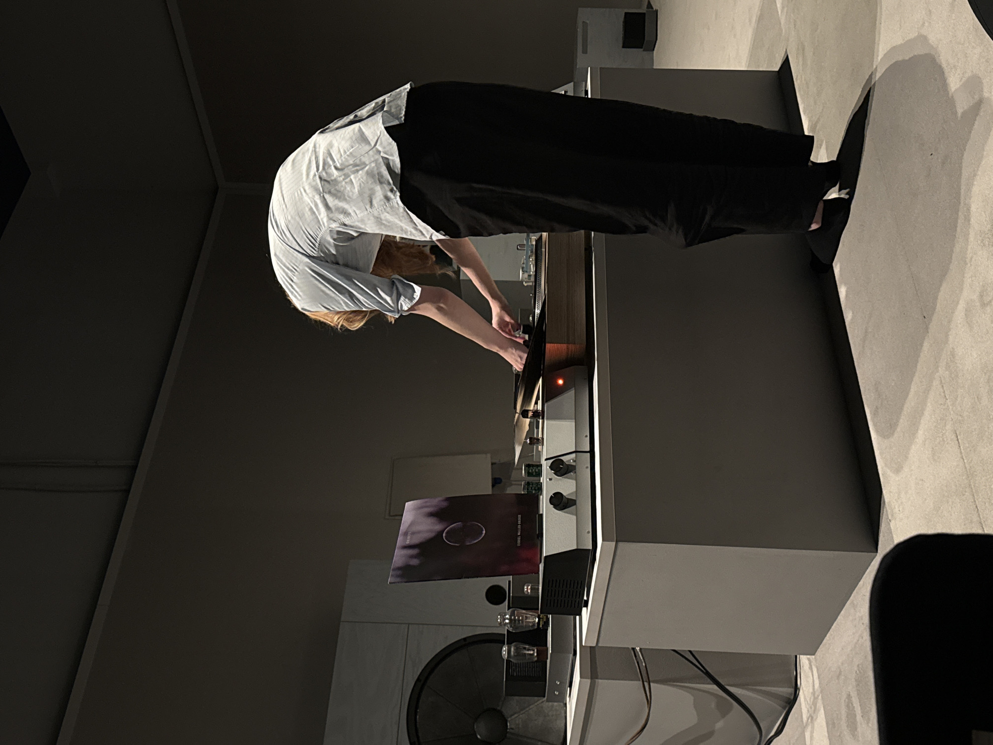 Person operates high-end audio equipment in London listening room