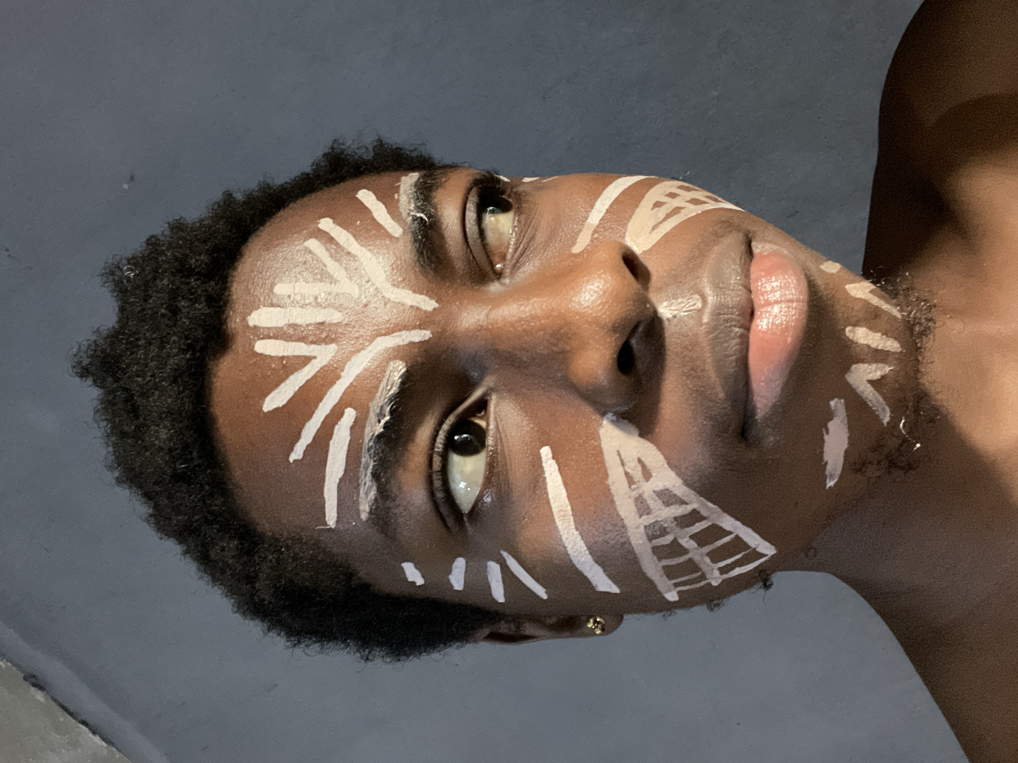Portrait session with traditional face paint documented in Nkpor