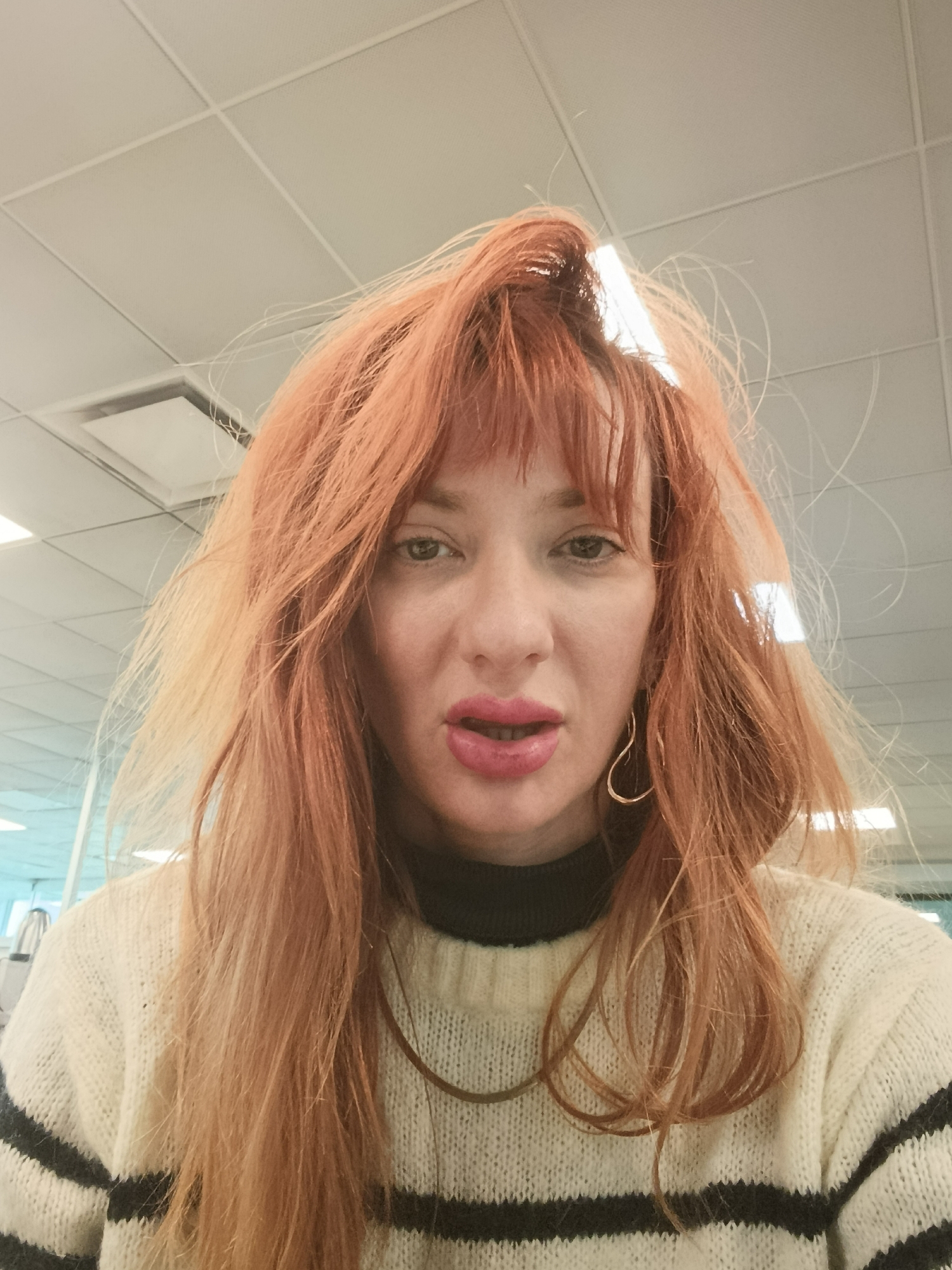 Woman in striped sweater photographed indoors in Buenos Aires