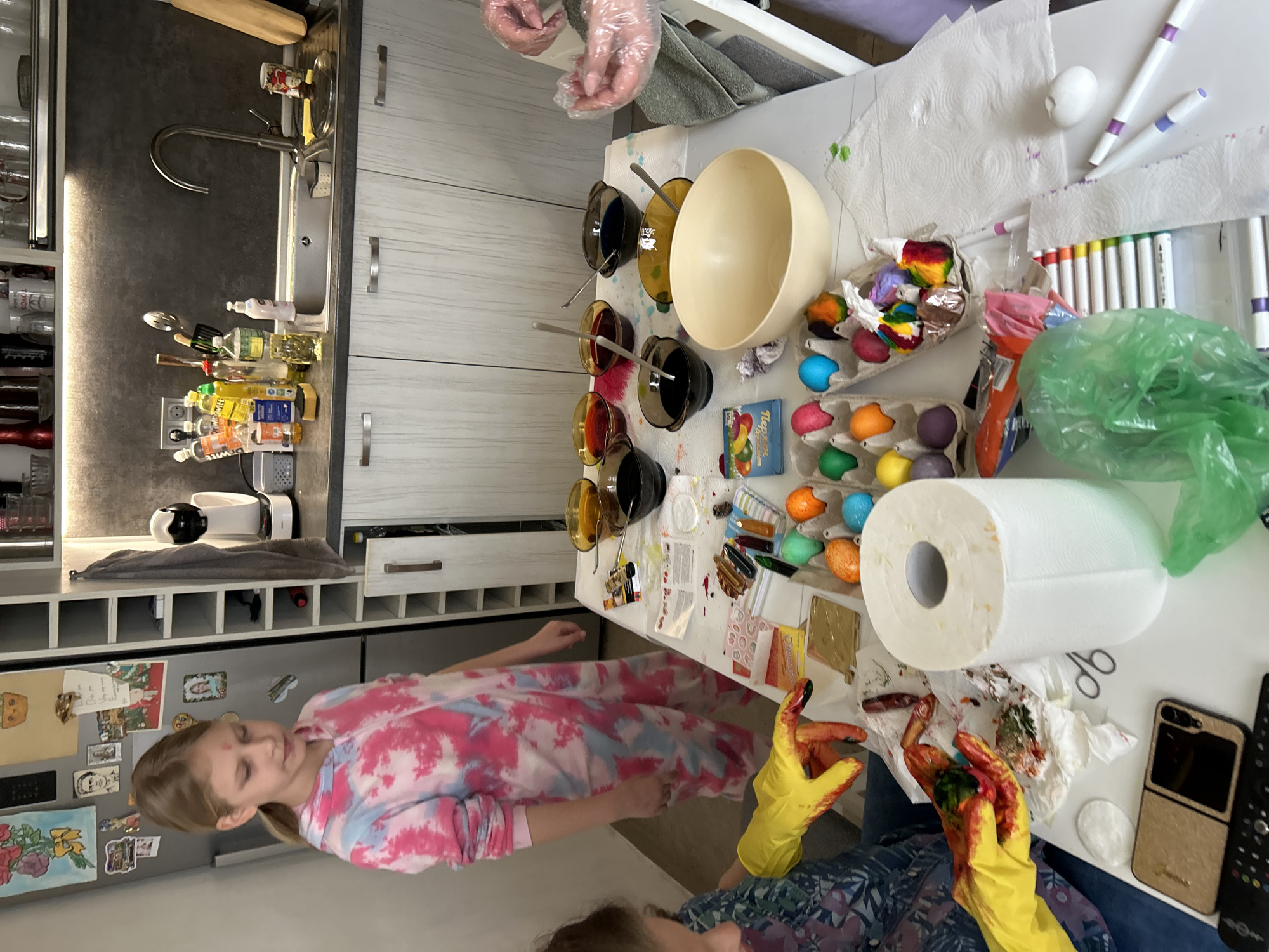 Family dyes Easter eggs in Sofia kitchen