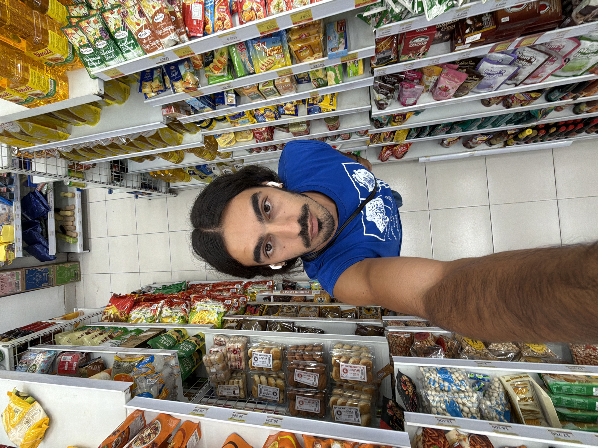 Man documents evening stroll through North Kuta with selfies