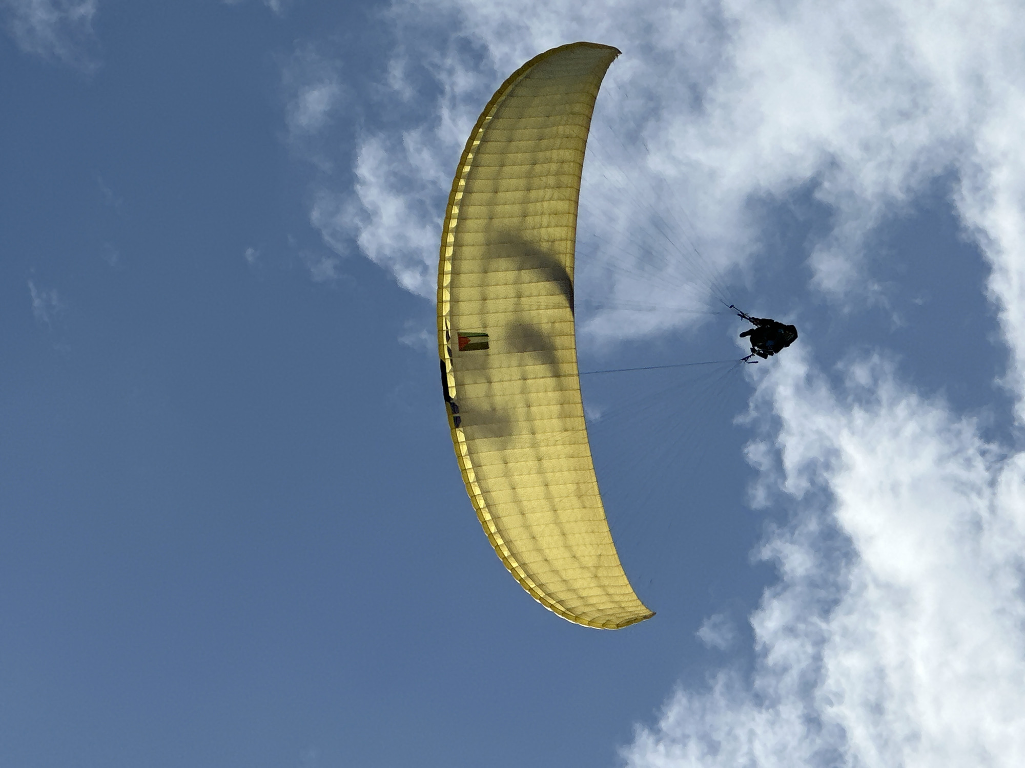 Paragliders soar over Fethiye Turkey in clear skies