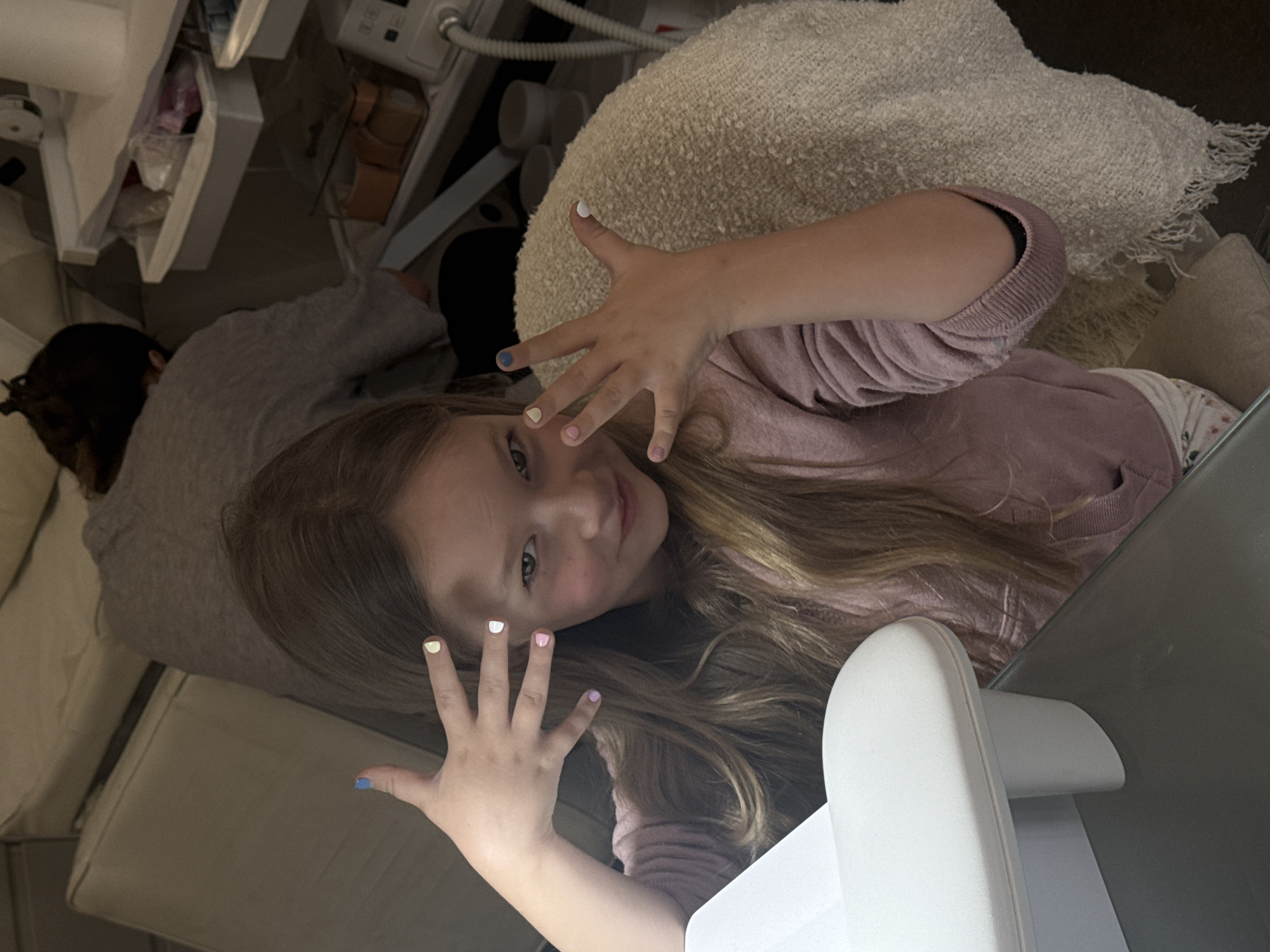 Young girl gets manicure at Bat Yam nail salon