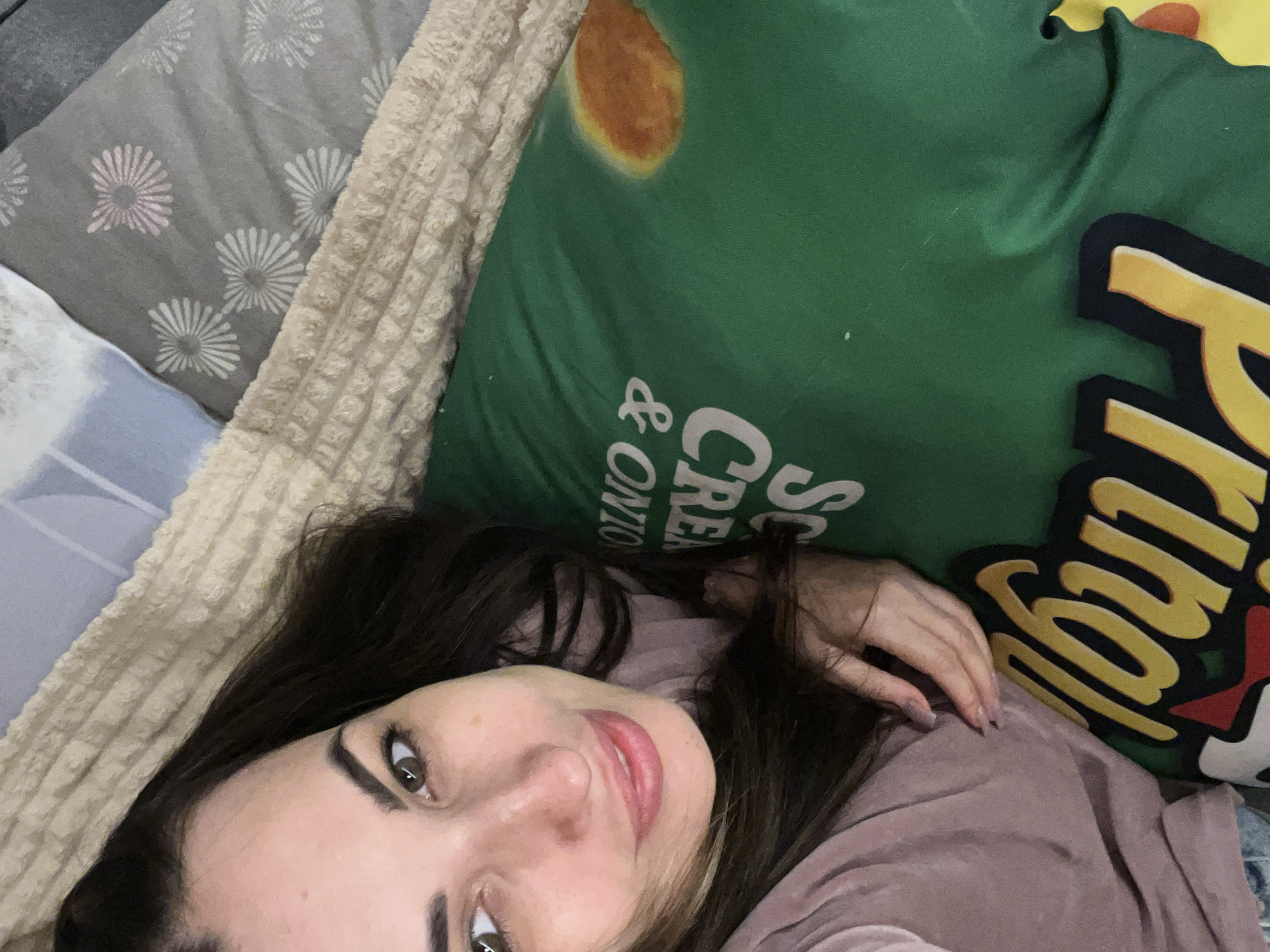 Woman documents casual day with selfies, toys, and child