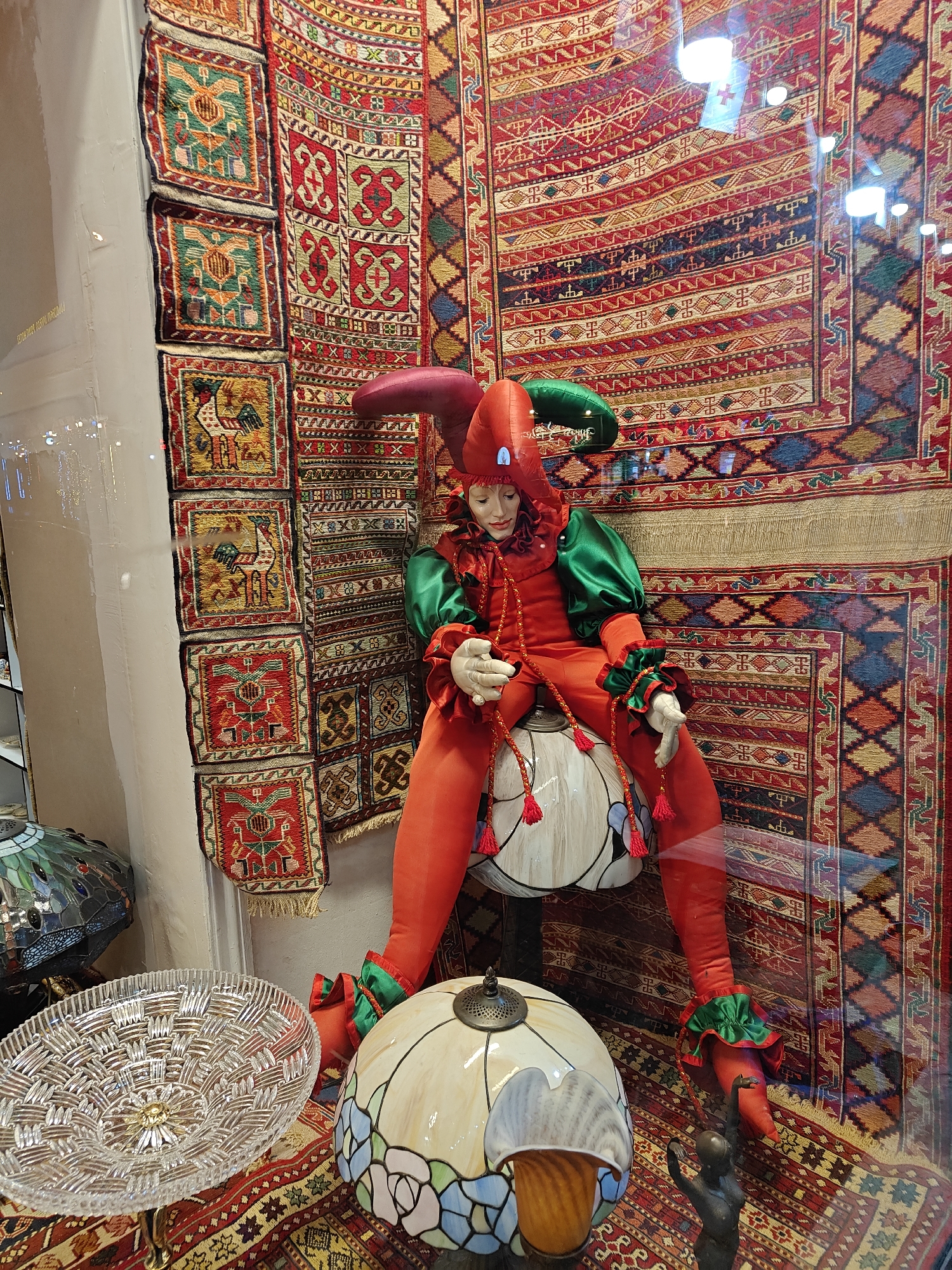 Ornate jester displays and rustic chandelier spotted in Tbilisi shop