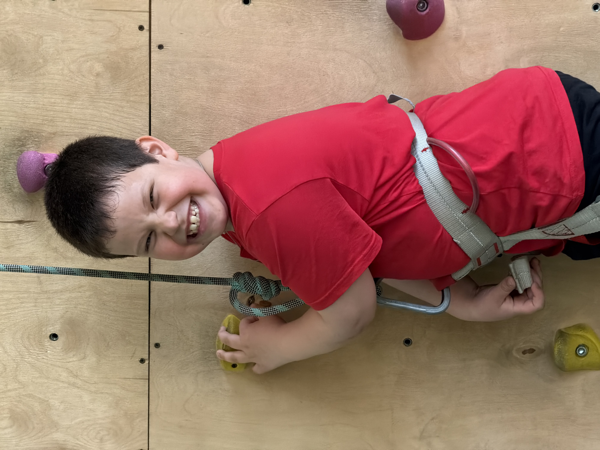 Children practice indoor rock climbing in Izhevsk facility