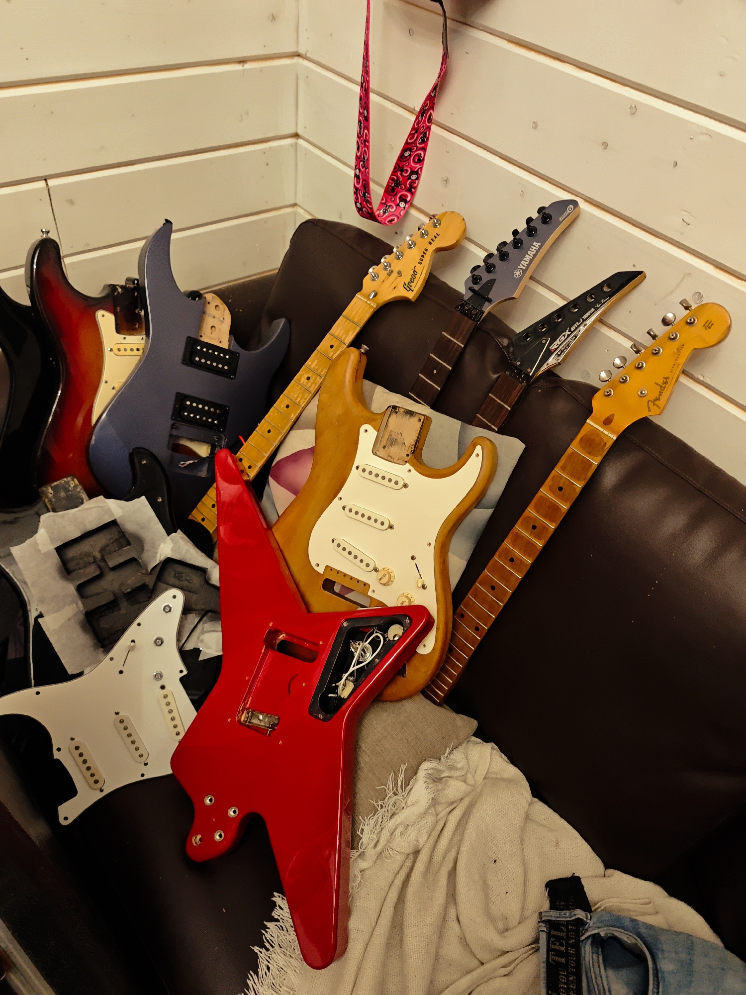 Musical instruments scattered in wood-paneled room in rural Russia