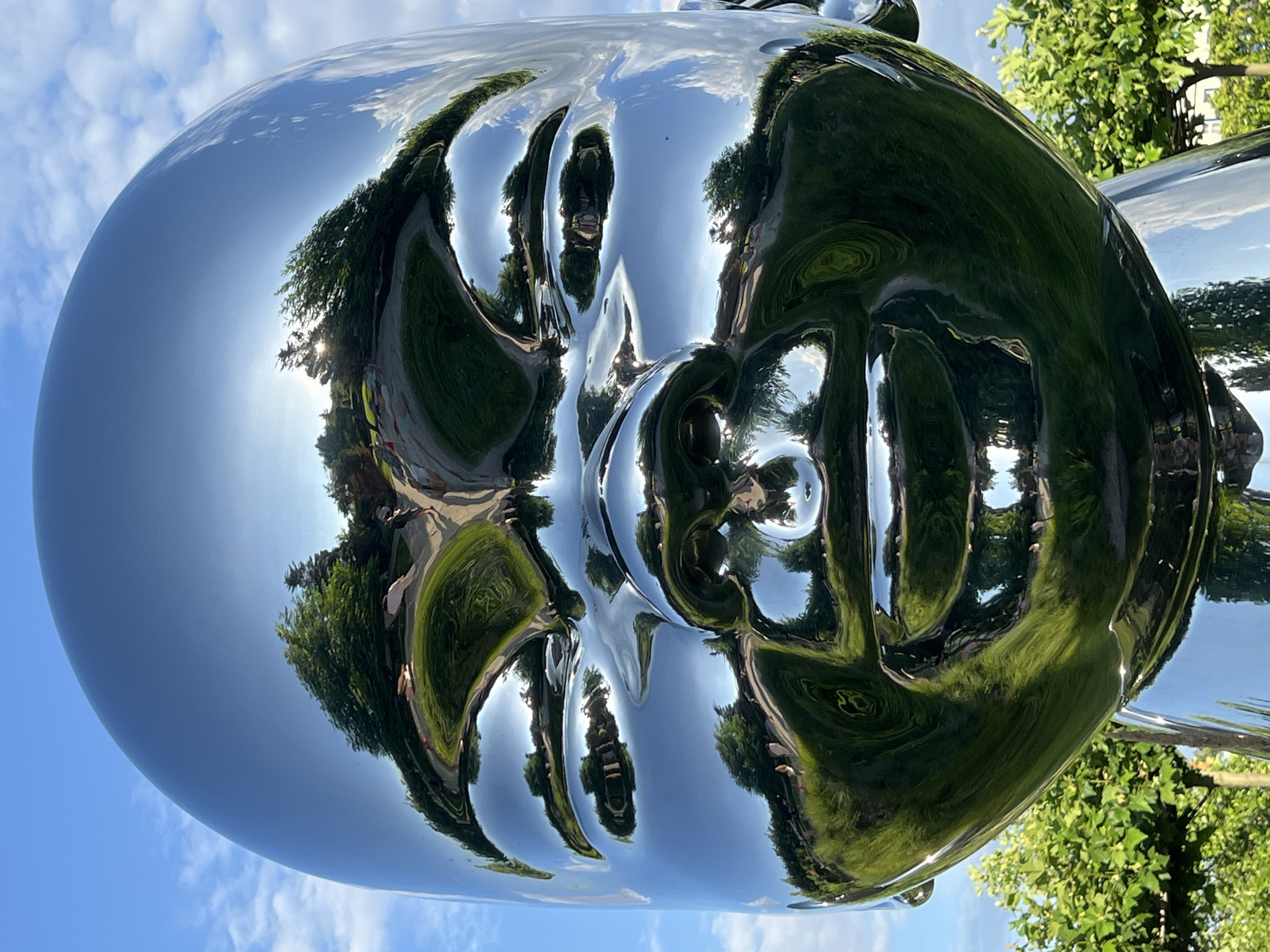 Afternoon in Krasnodar's riverside park among chrome sculptures
