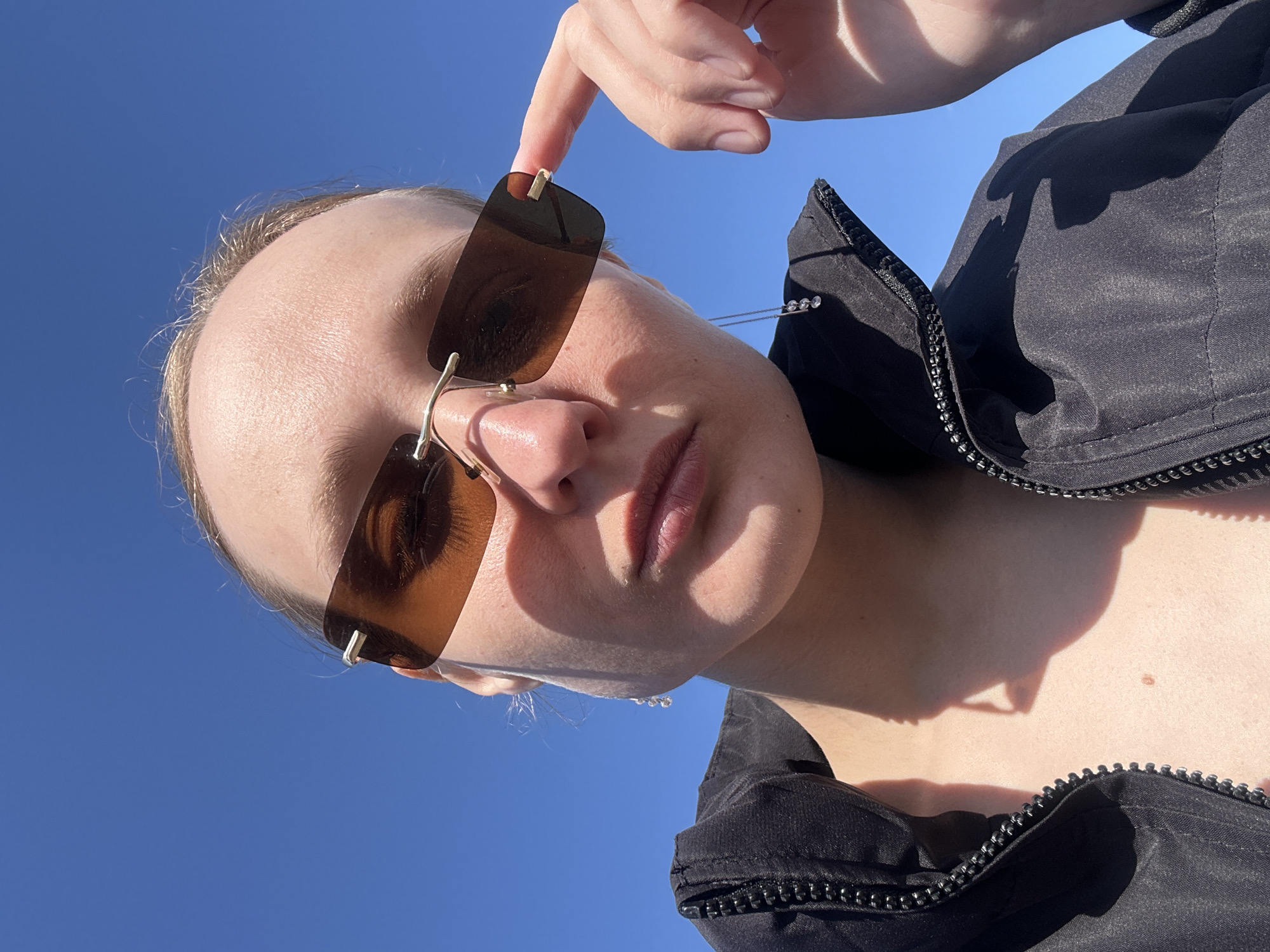 Person documents sunny morning in Russian residential neighborhood