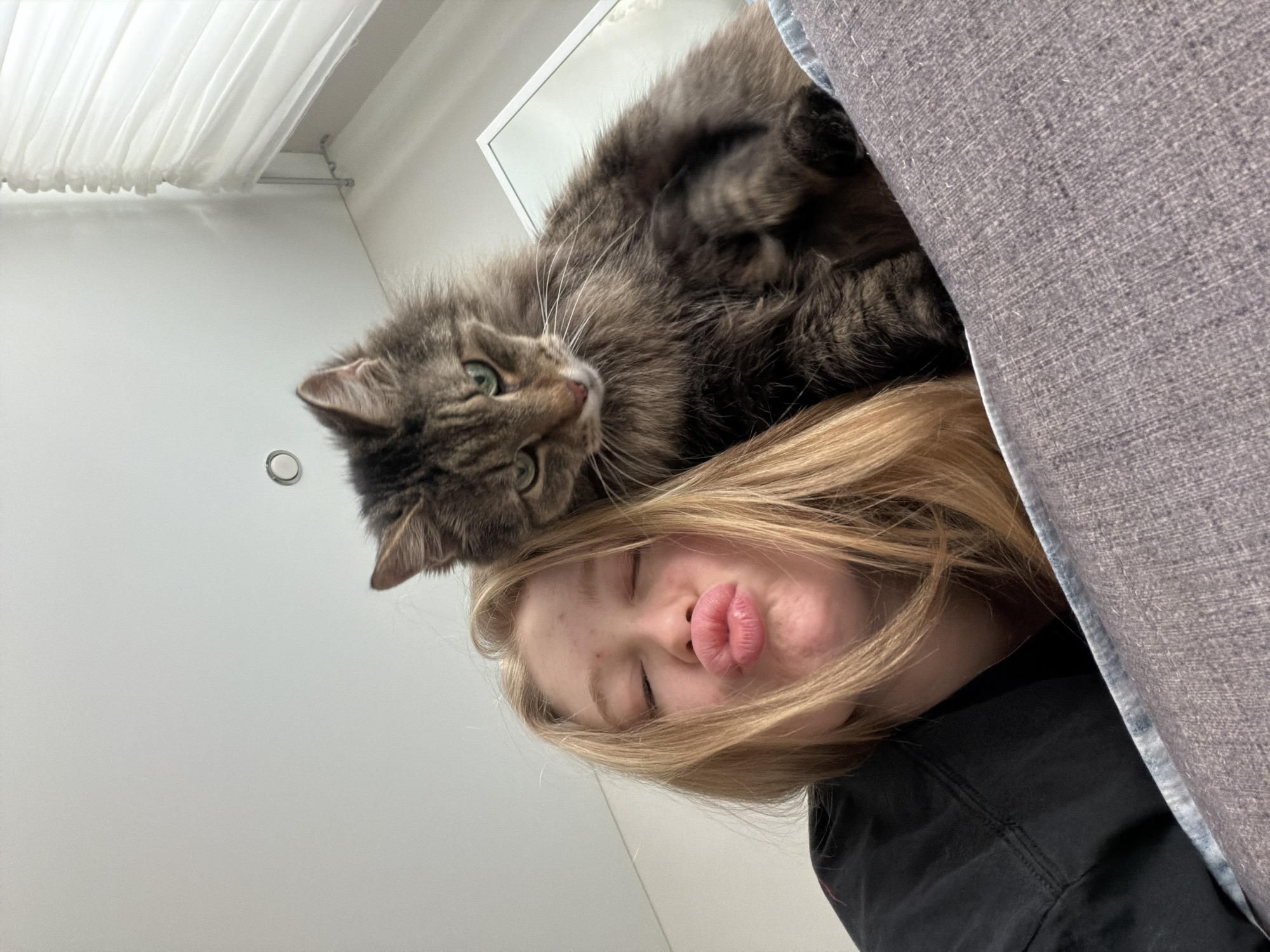 Woman shares quiet moment with tabby cat in Russia
