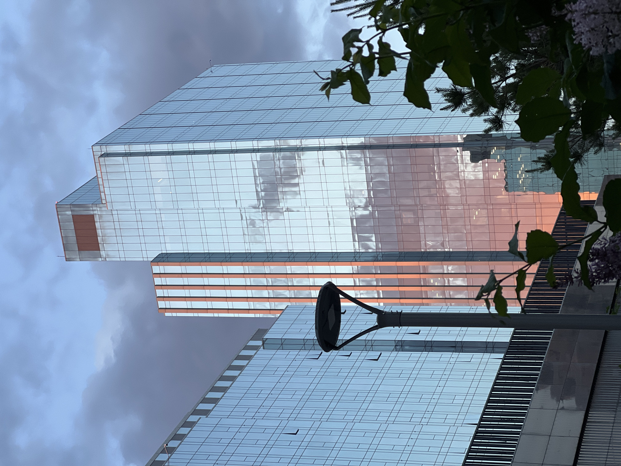Tourist documents modern Astana architecture during afternoon walkabout
