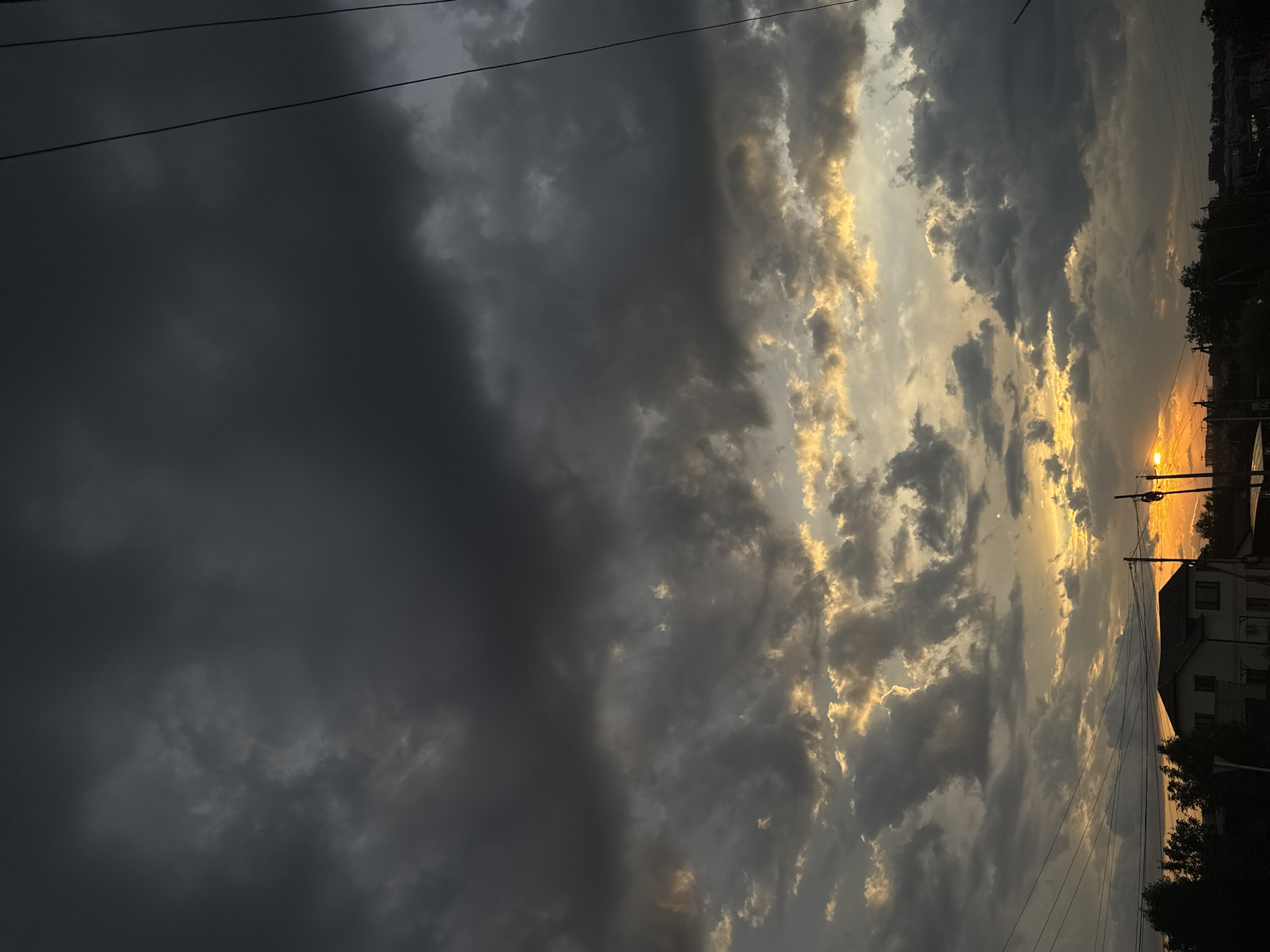 Storm clouds and golden light at sunset in Mikhaylovsk