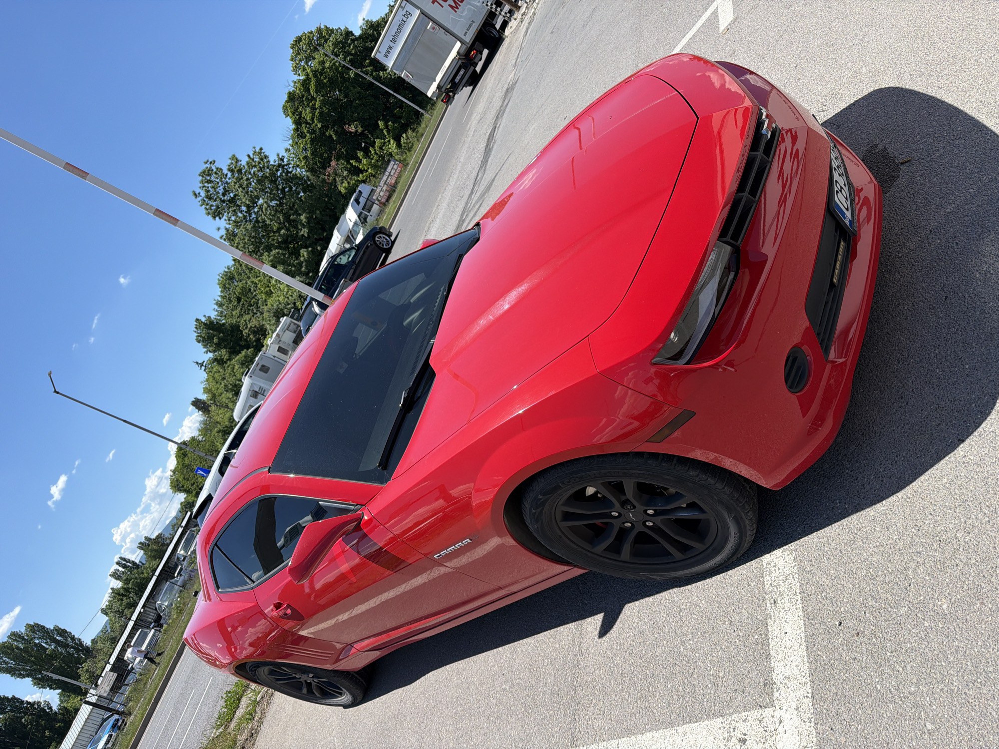 Red Camaro spotted in sunny parking lot