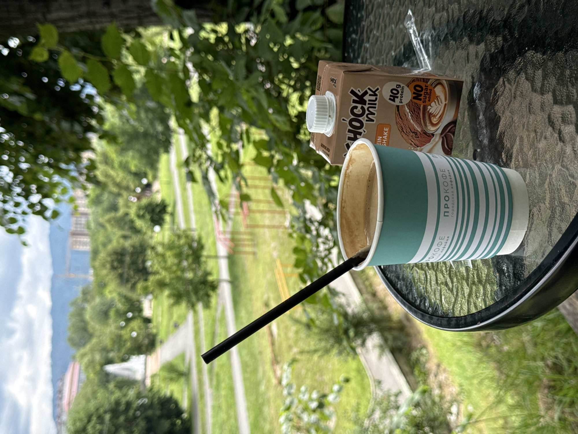 Coffee and protein milk on a glass table in Vladikavkaz