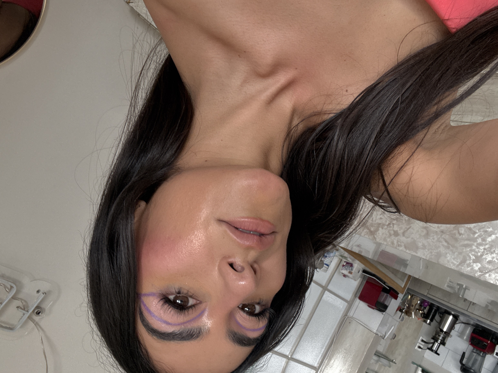 Woman takes selfies indoors in Puebla, Mexico
