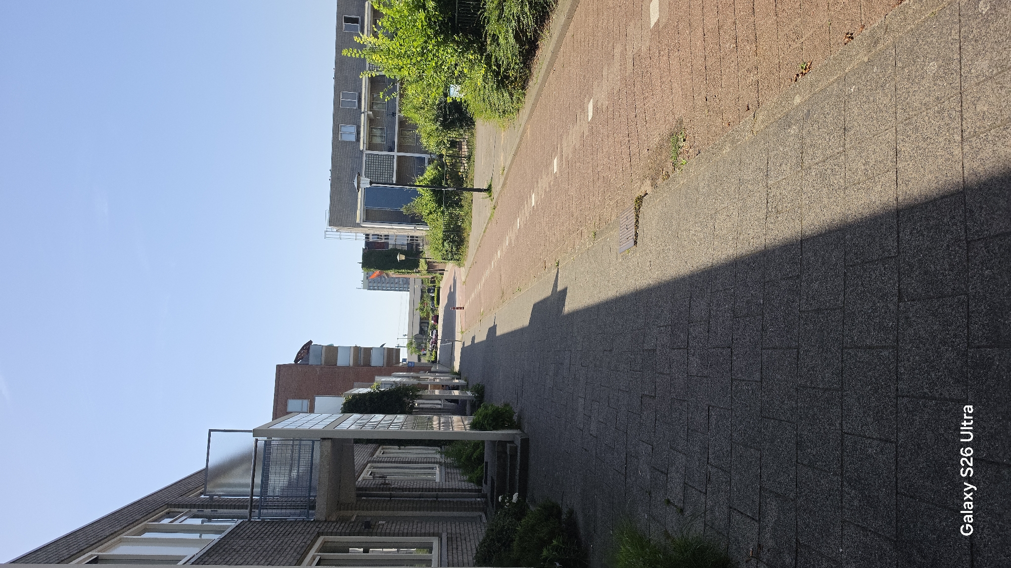 Sunny morning in Vlaardingen: streets, rooftops, and an RET train