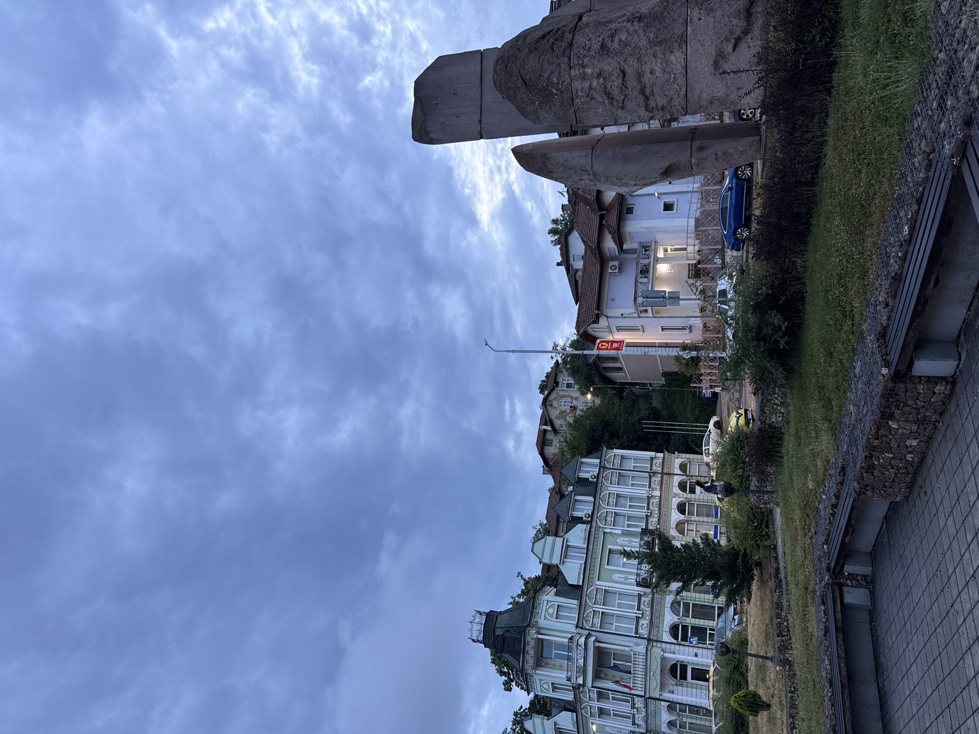 Lovech street corner, gabion walls and white building at dusk