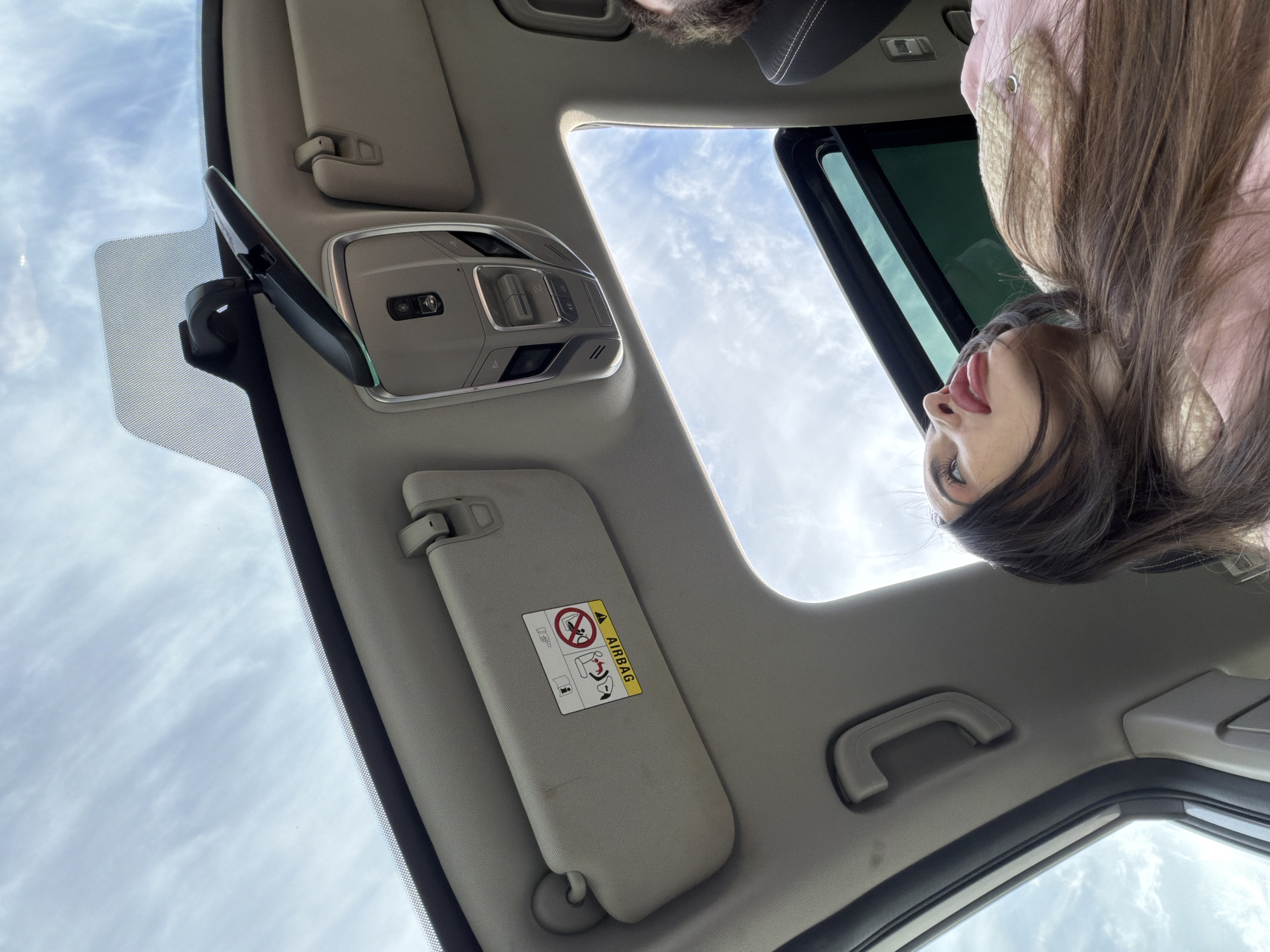 Woman films video from car passenger seat in Saint Petersburg