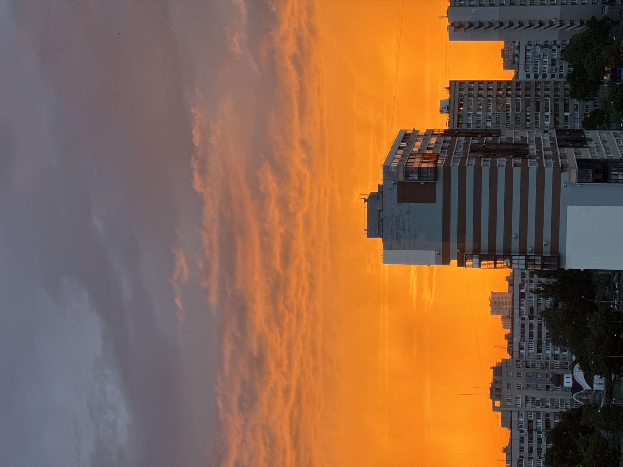 Fiery sunset burns across a city skyline