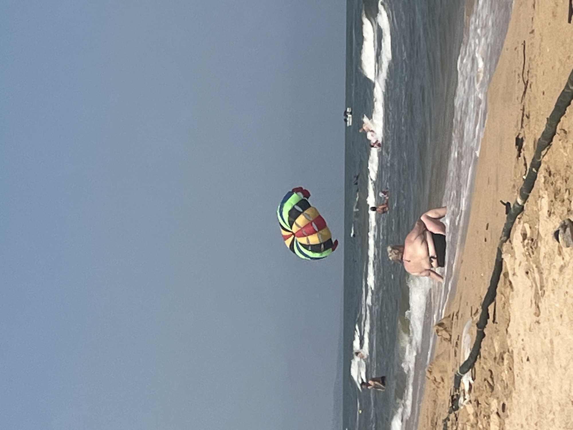 Summer beach day at Golubitskaya, parasailing and shoreside relaxing