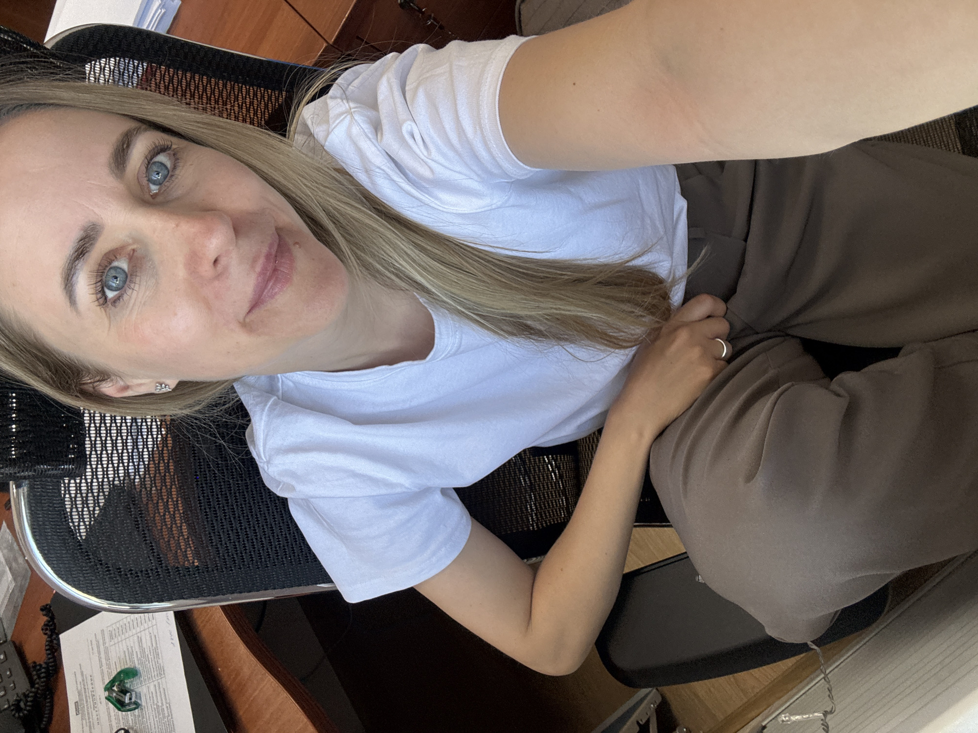 Woman observed at office desk in Chaikovsky, Russia
