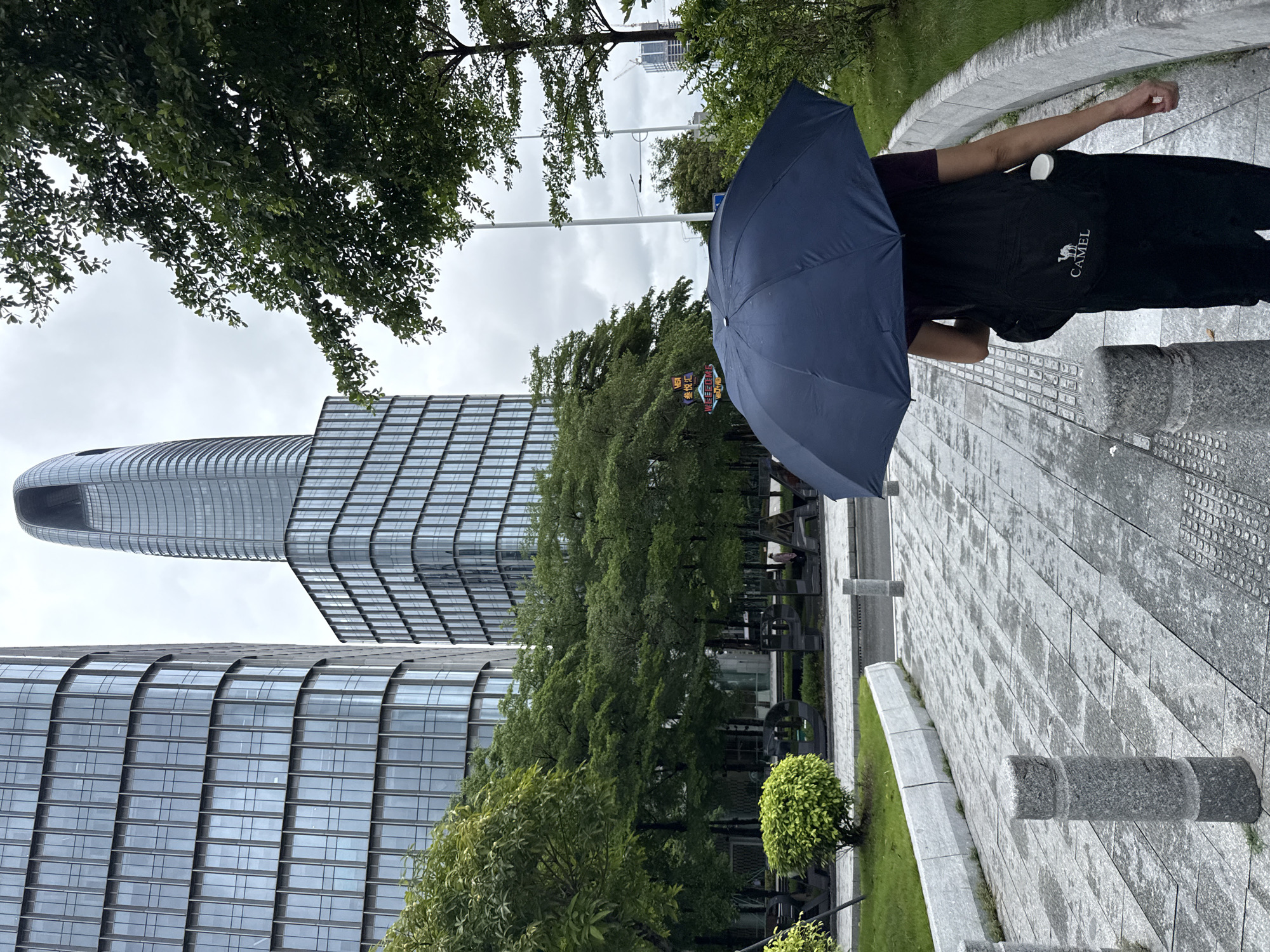 Wet streets and glass towers in Haizhu District after morning rain