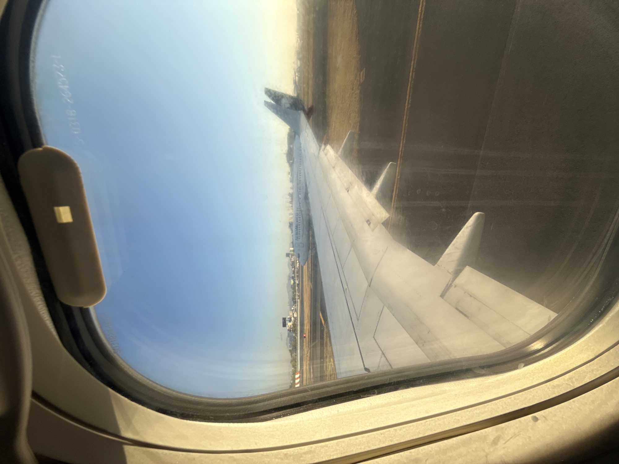 Passenger documents wing view during Mexico City airport operations