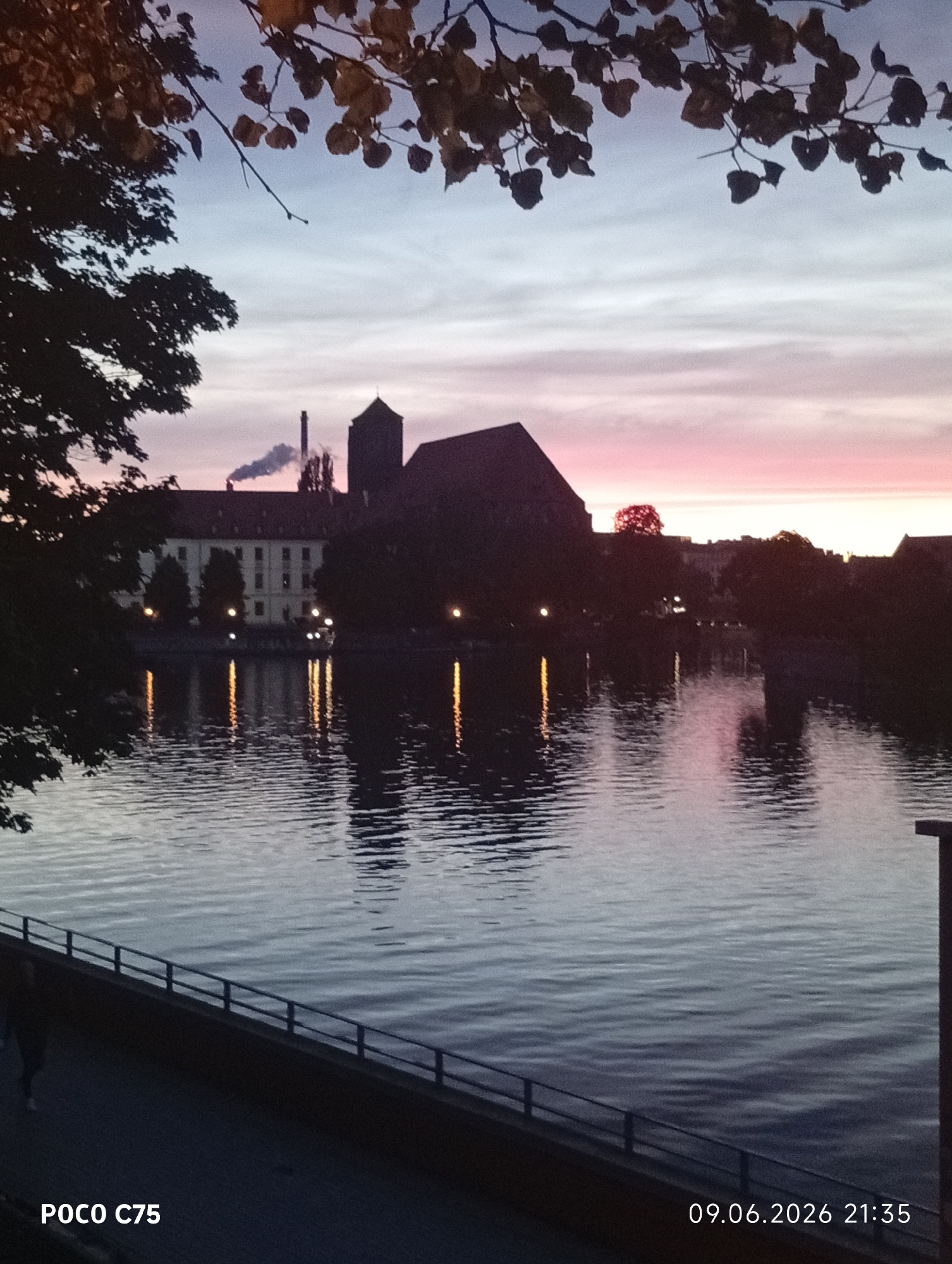 Sunset gathering documented along Oder River in Wrocław, Poland