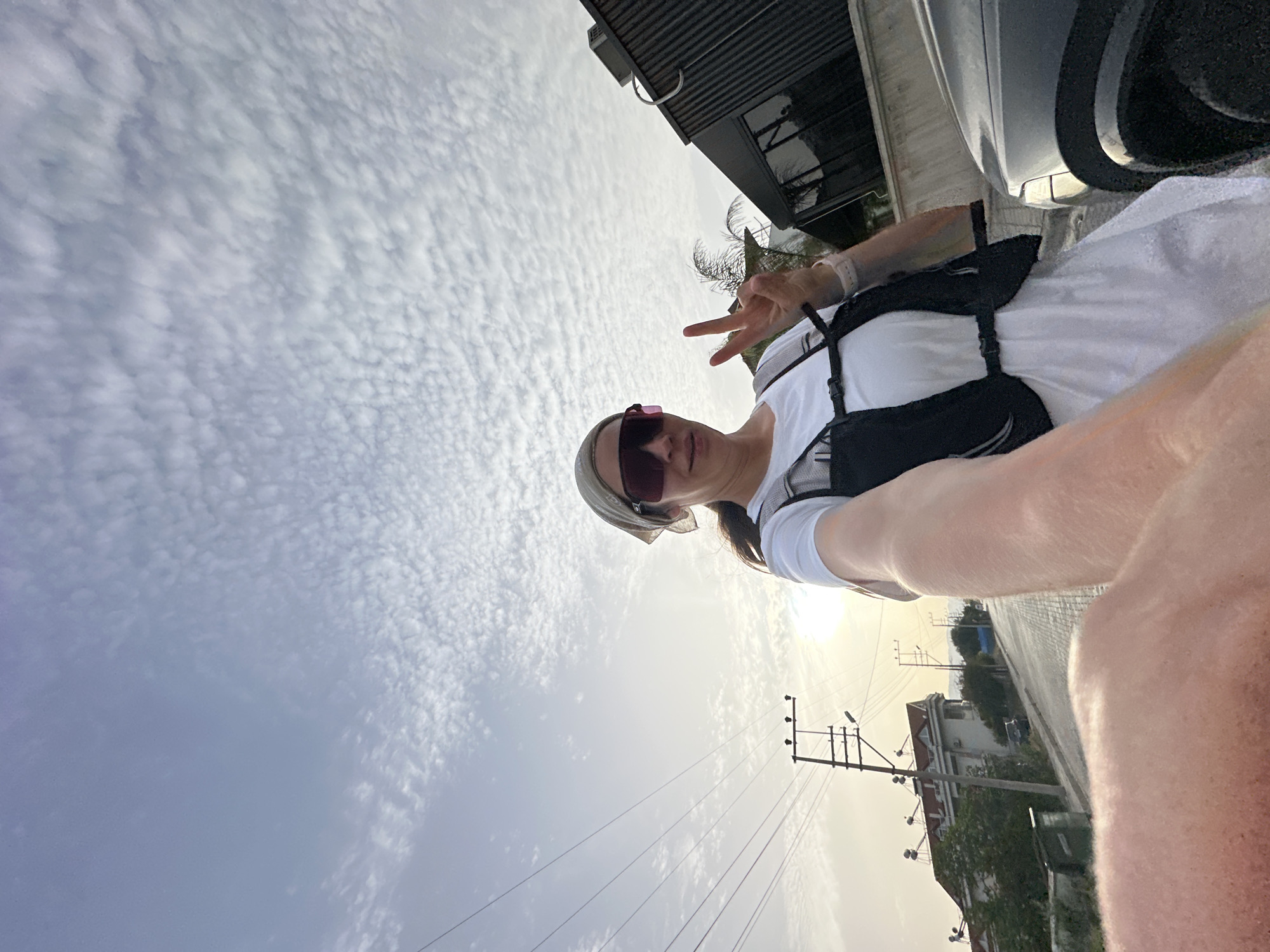 Woman takes selfie with peace sign in Fethiye, Turkey
