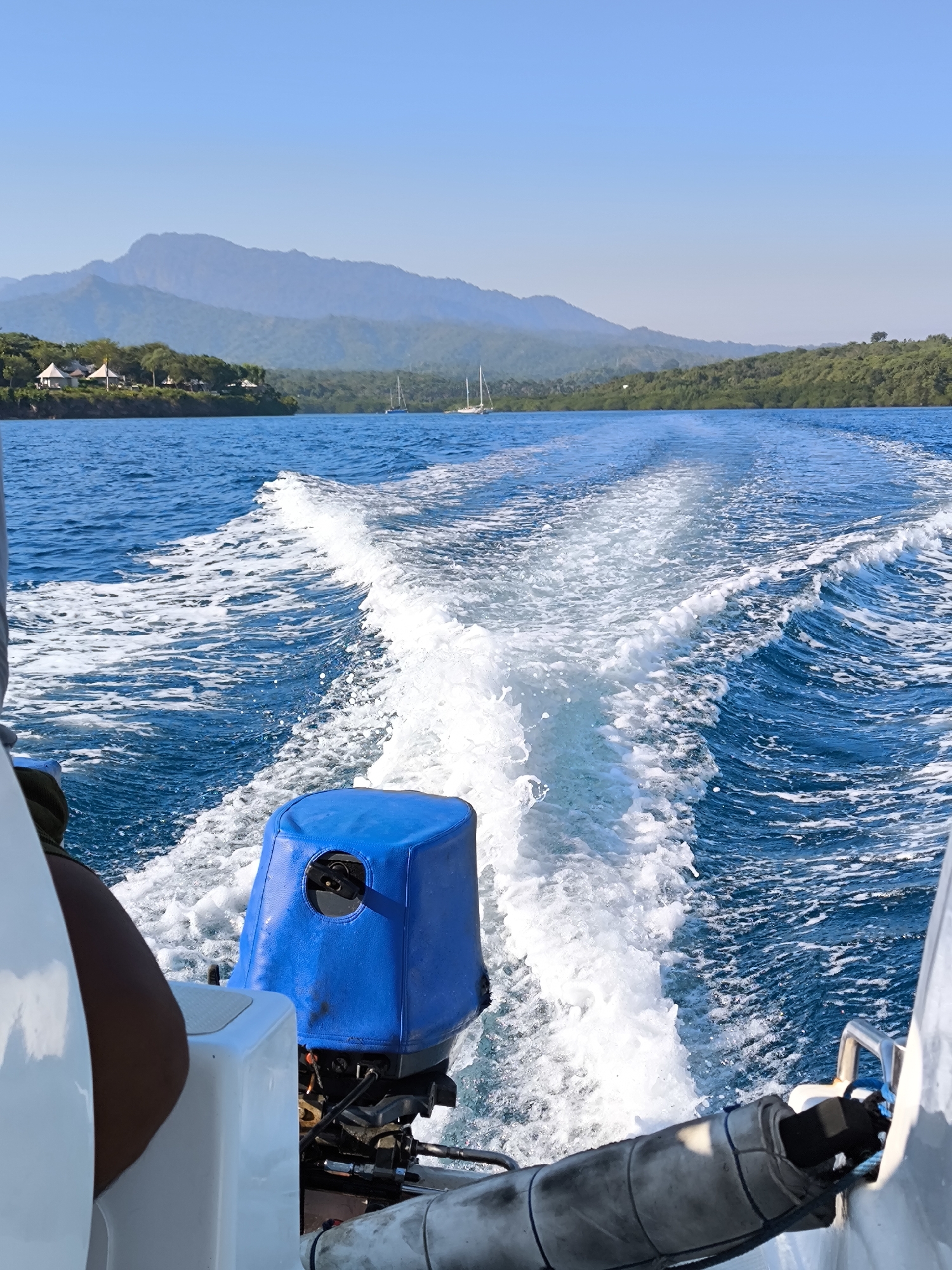 Powerboat travels coastal waters near Gerokgak, Indonesia