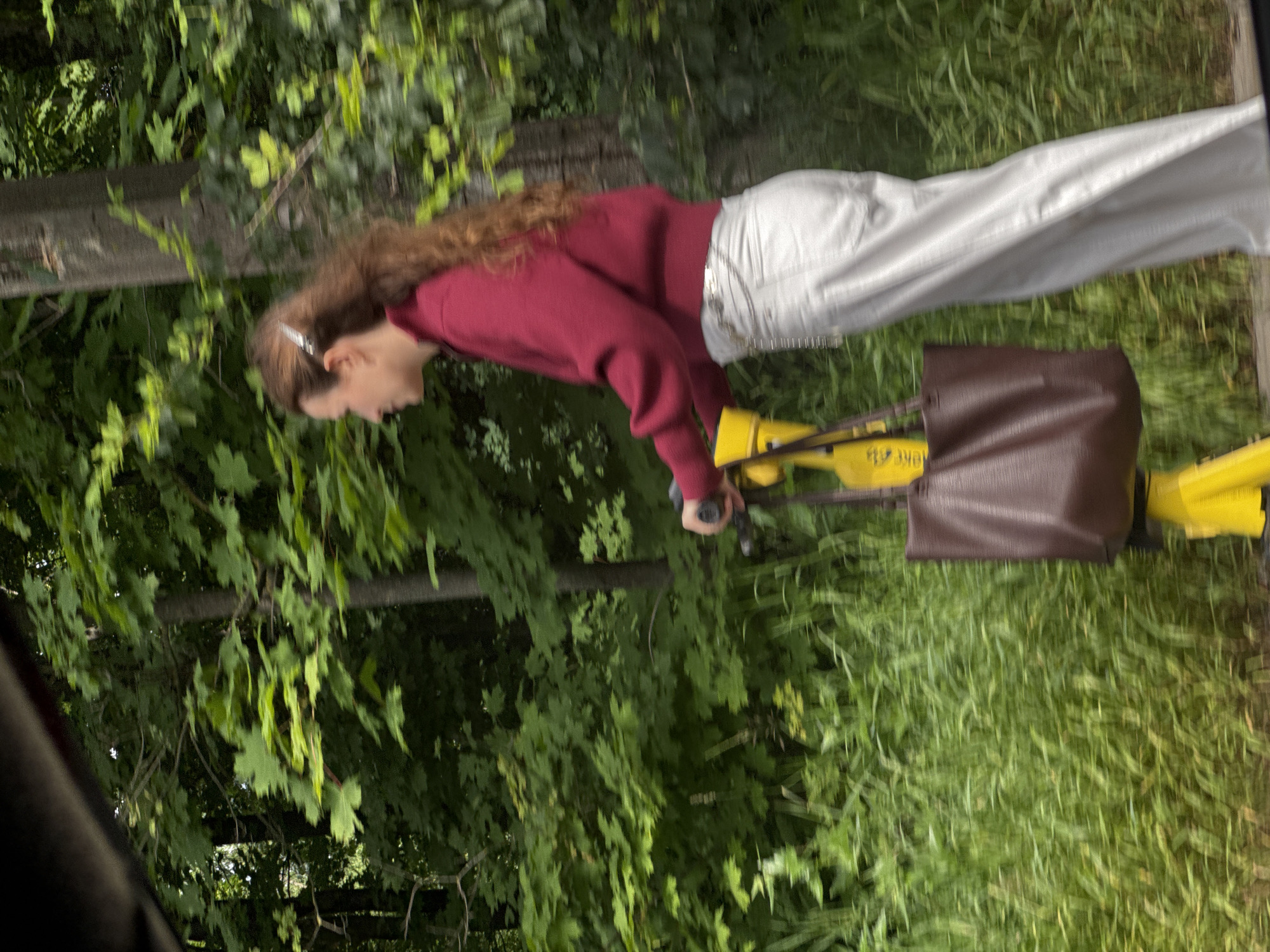 Cruising a Saint Petersburg path on a yellow electric scooter