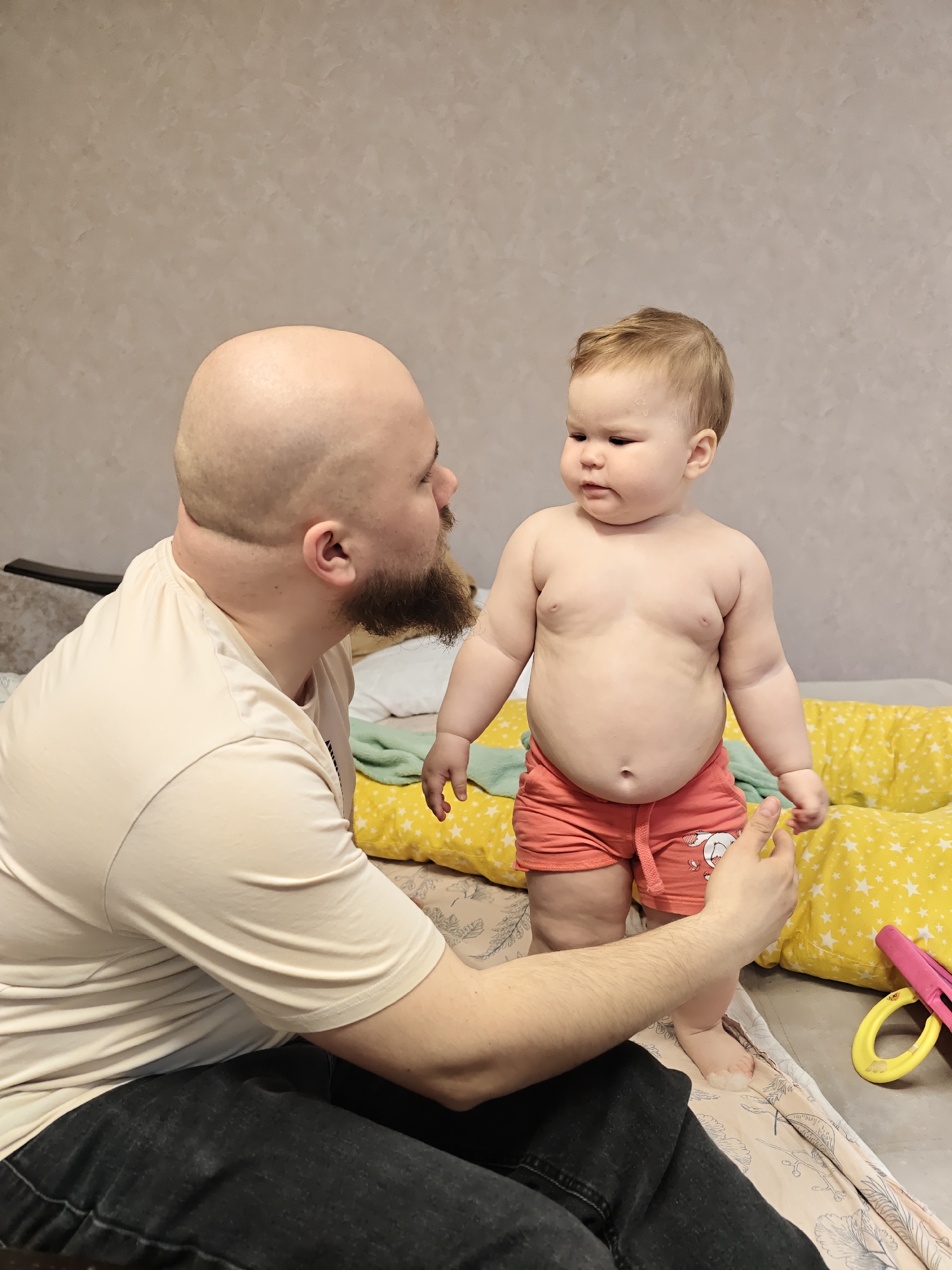 Father and baby share morning moments in Chaikovsky bedroom
