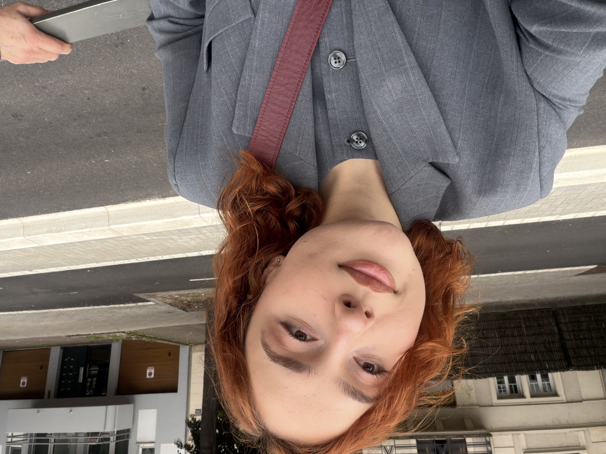Red-haired person takes selfies in Strasbourg
