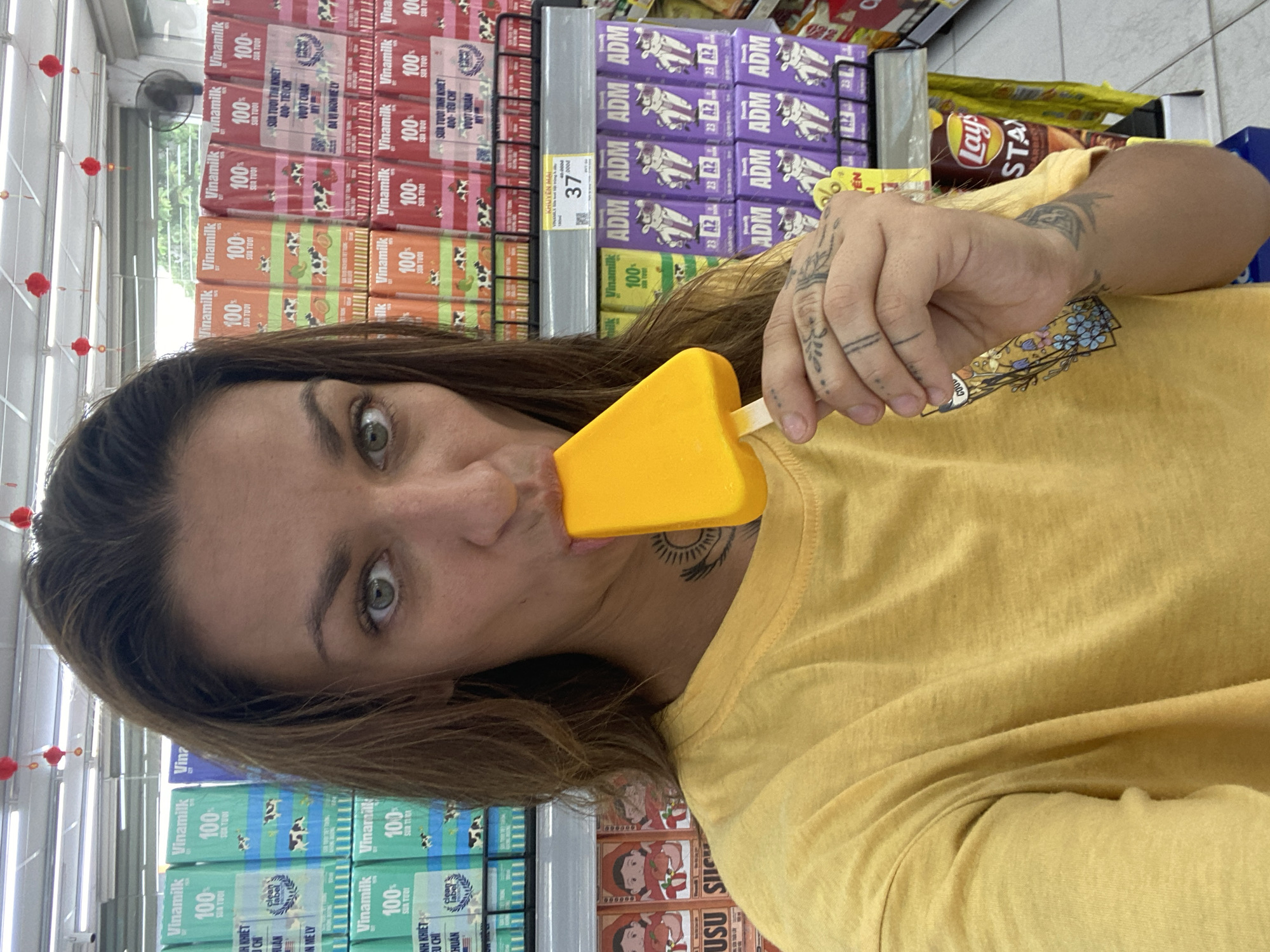 Woman samples frozen treats while shopping in Đồng Nai stores