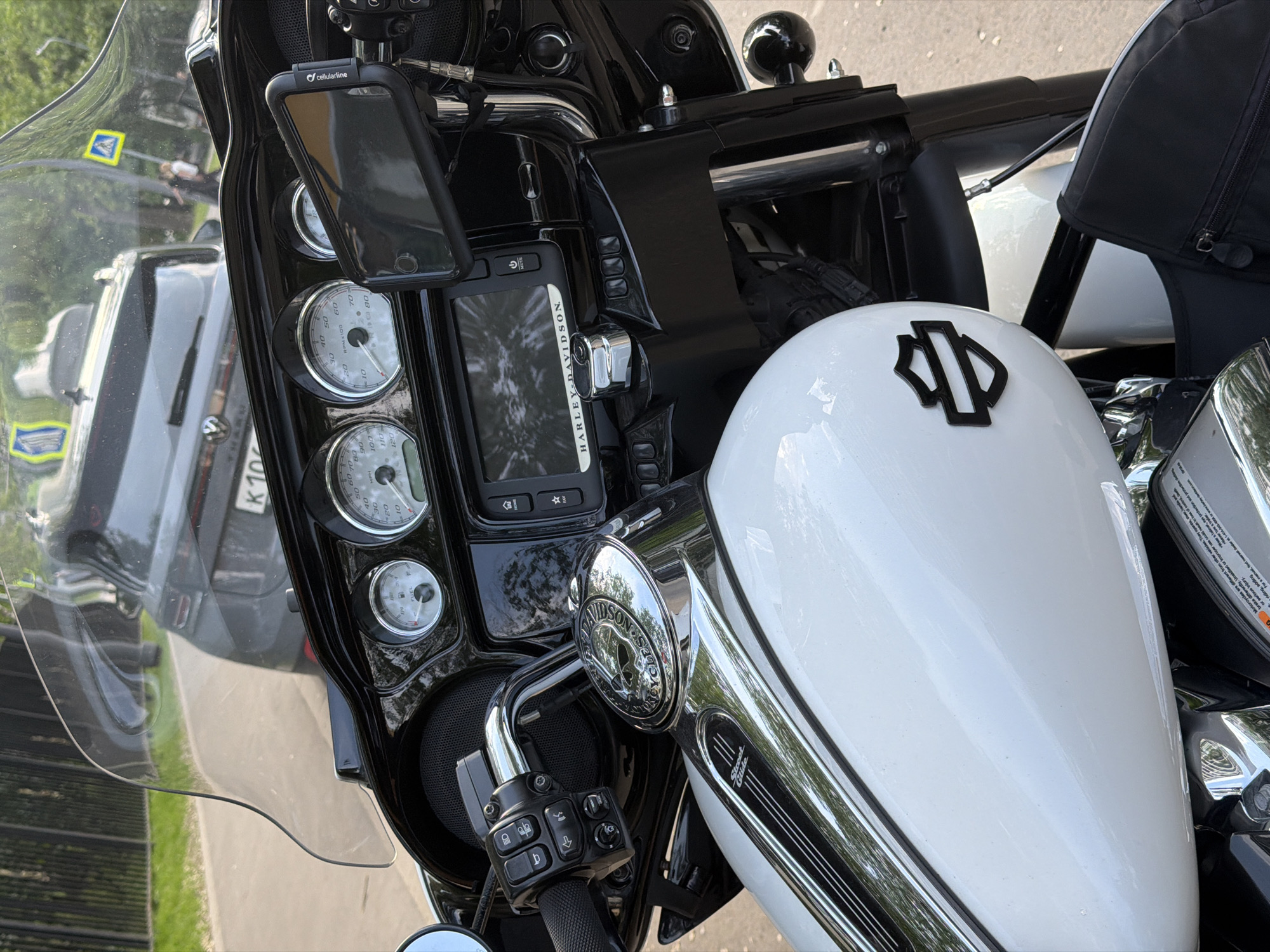 Harley-Davidson motorcycle parked beside Opel car in Moscow