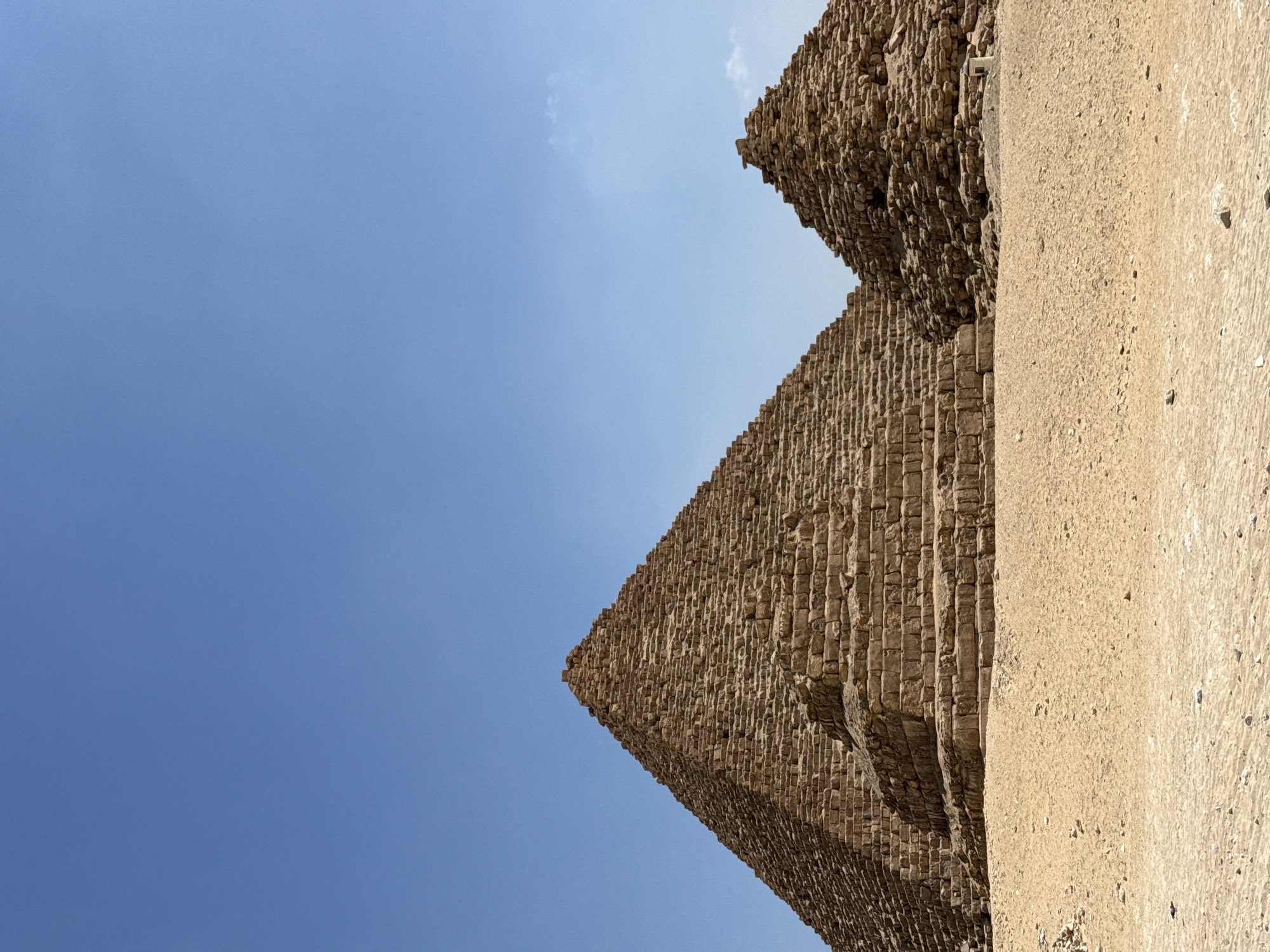 Two Giza pyramids under a clear blue Egyptian sky