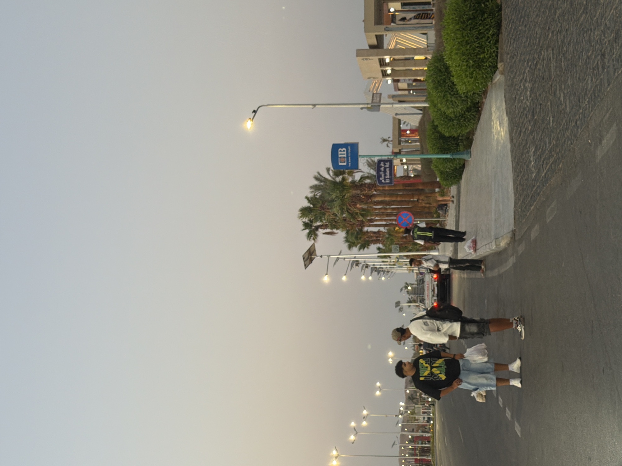 Evening foot traffic along Sharm El Sheikh's lit promenade and bike route