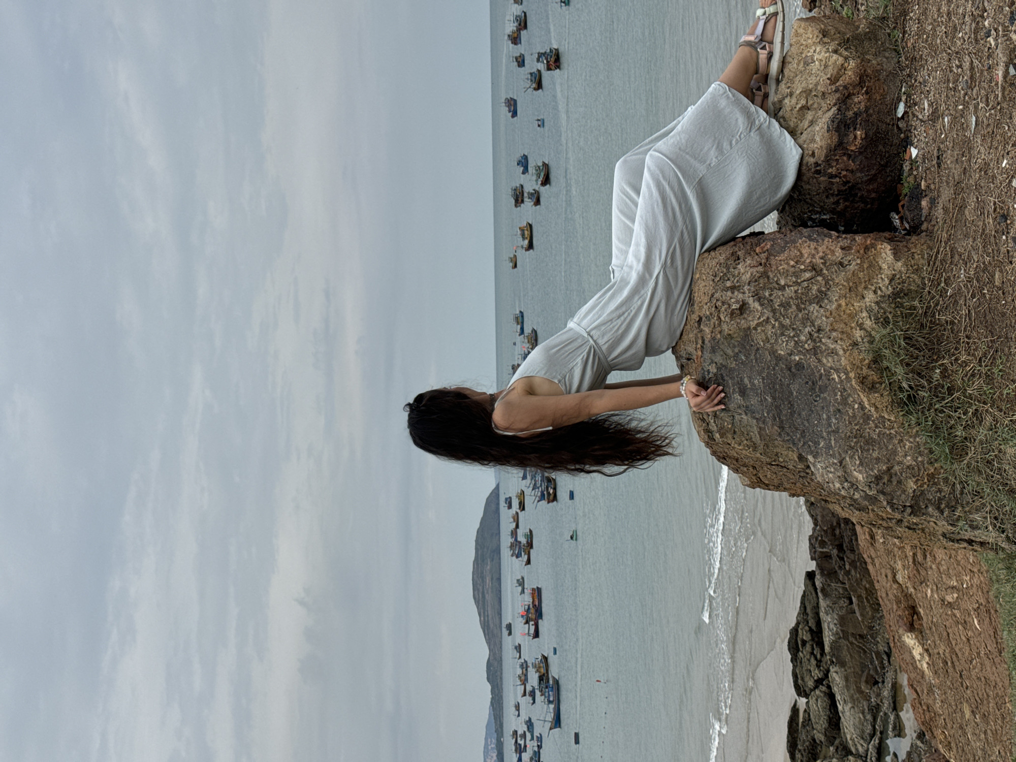 Woman visits coastal viewpoints and Buddhist temple in Mui Ne