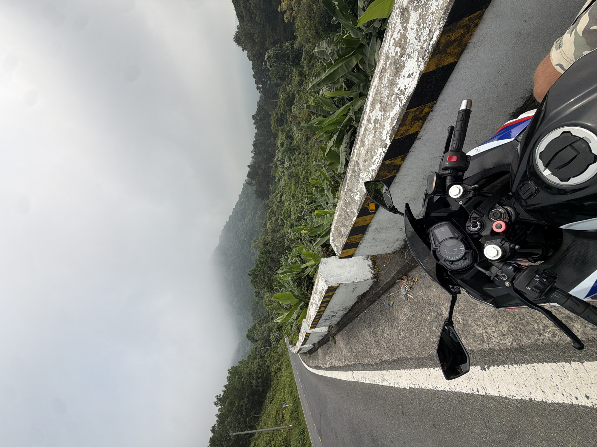 Motorcycle parked on foggy Hai Van Pass near Đà Nẵng