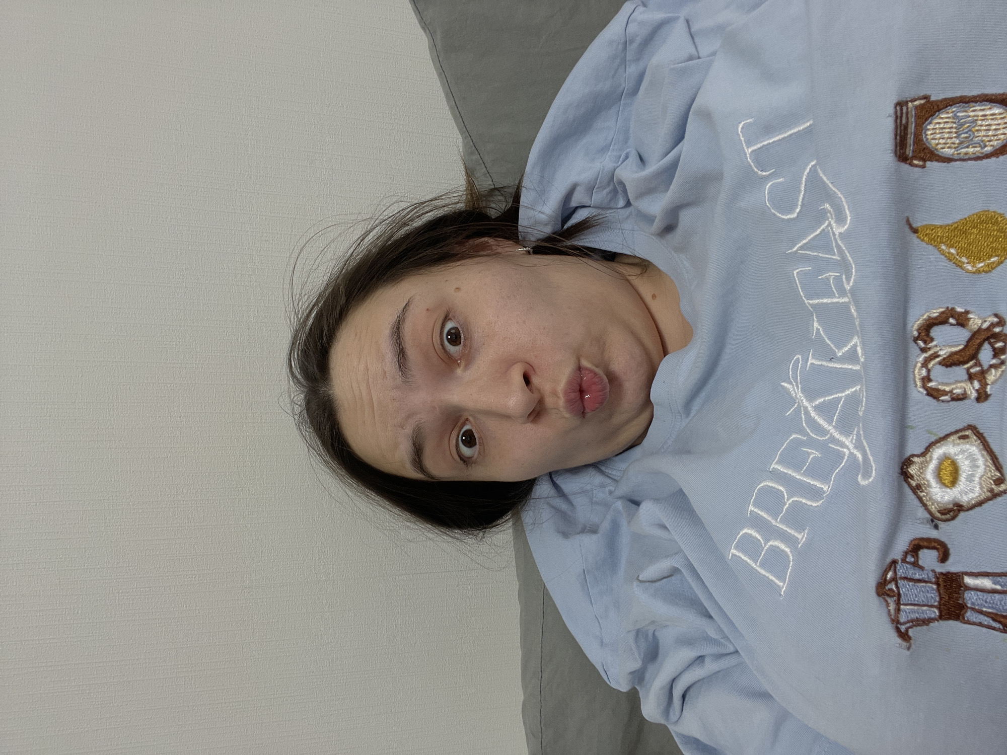 Woman photographed resting playfully on pillow in Balashikha