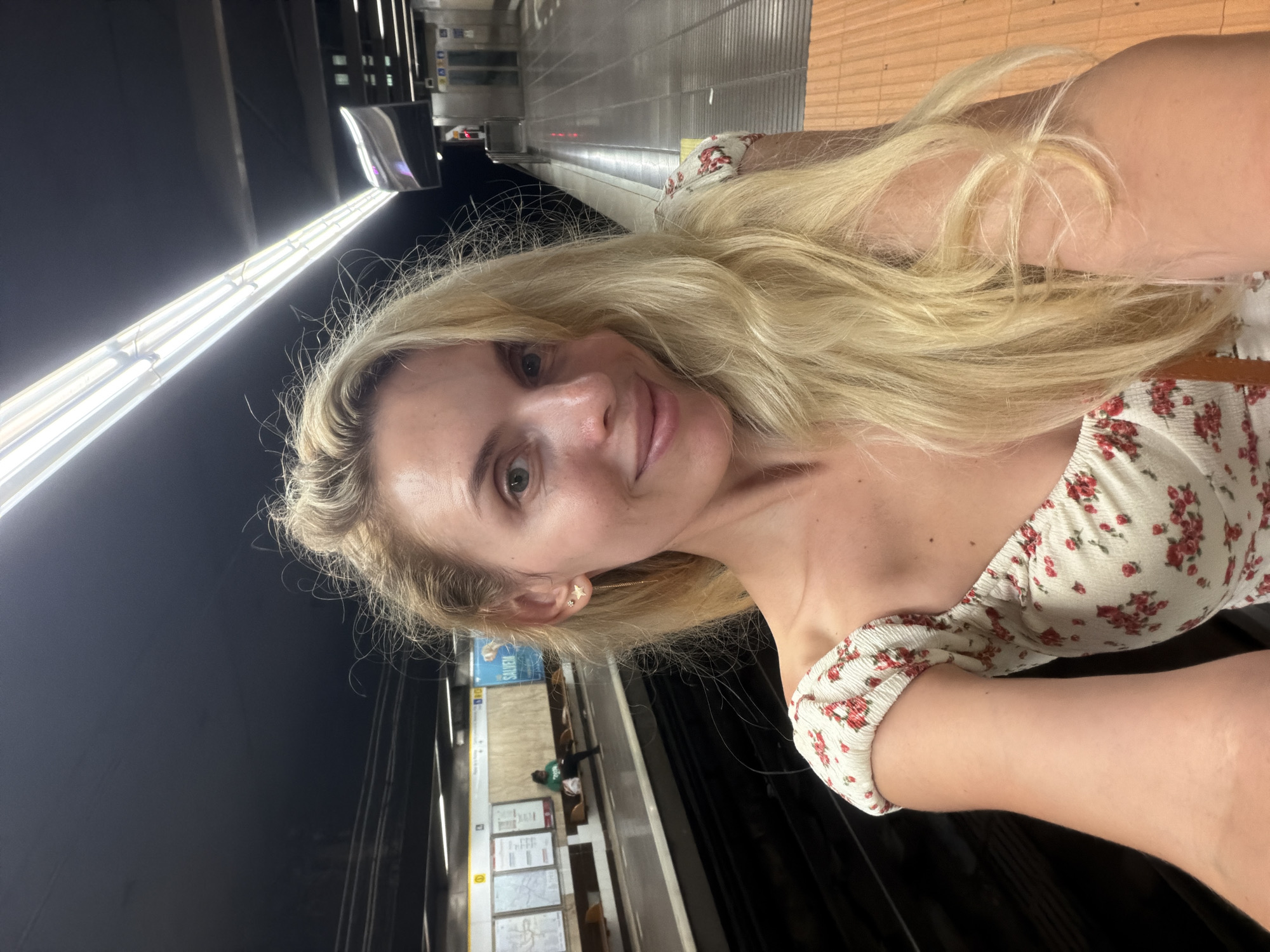Subway platform pause: selfie, then a bench sit-down.