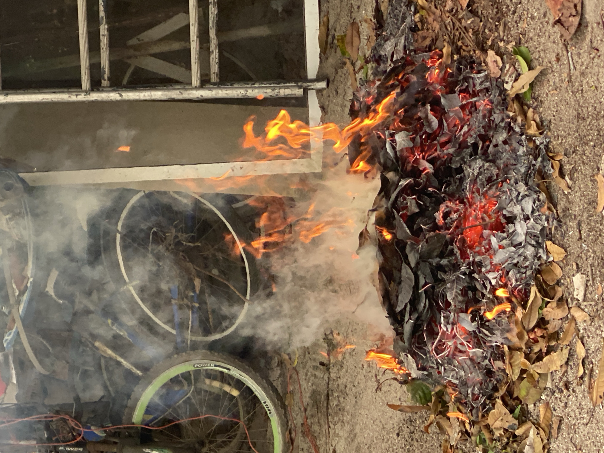 Leaf fire burns in Baan Kai, Thailand neighborhood