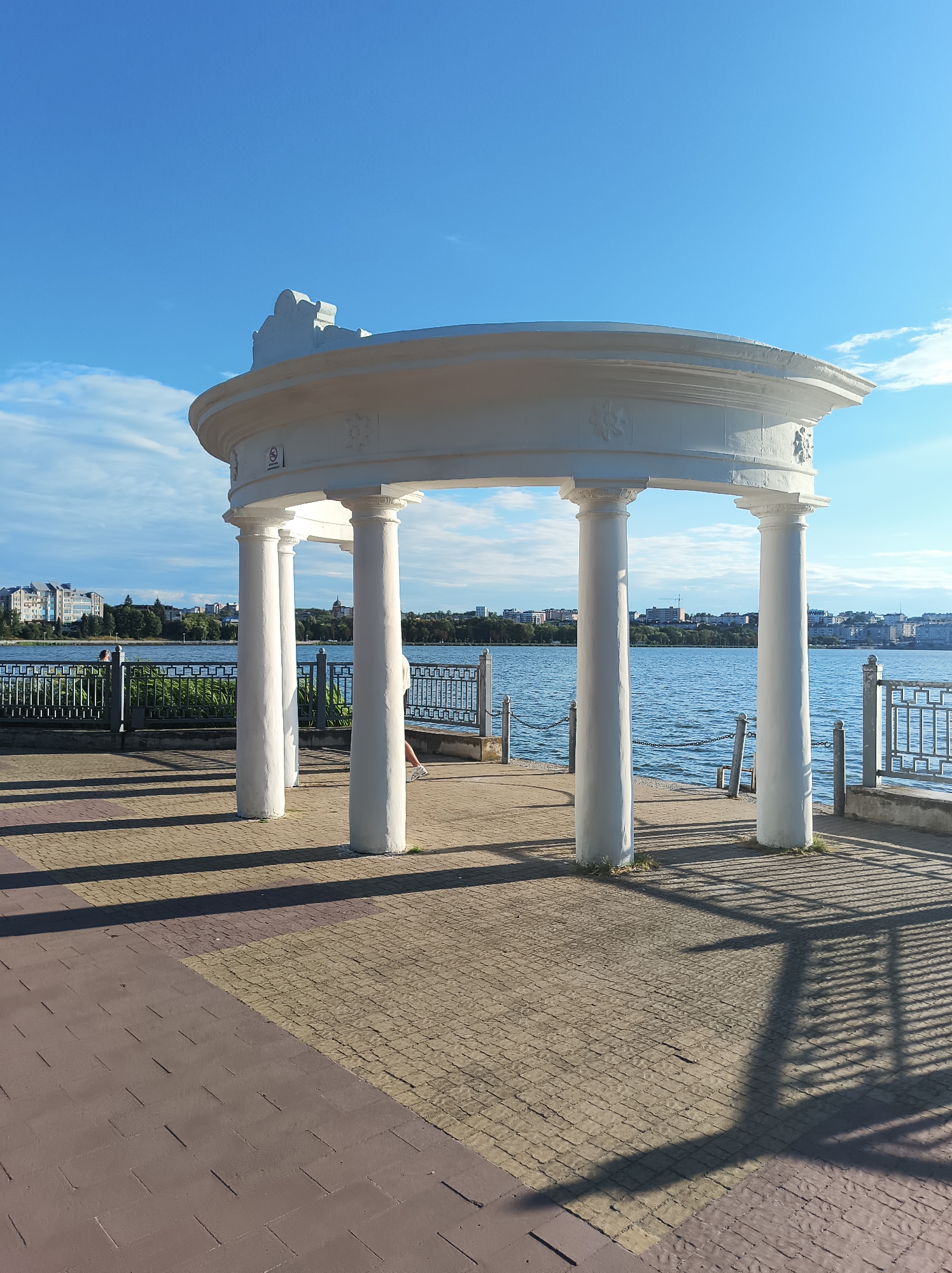 Sunny afternoon along Ternopil Pond's promenade and parkways