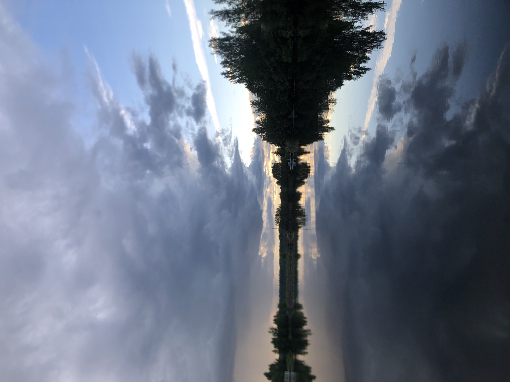Dramatic summer sky and water along the Svir River at dusk