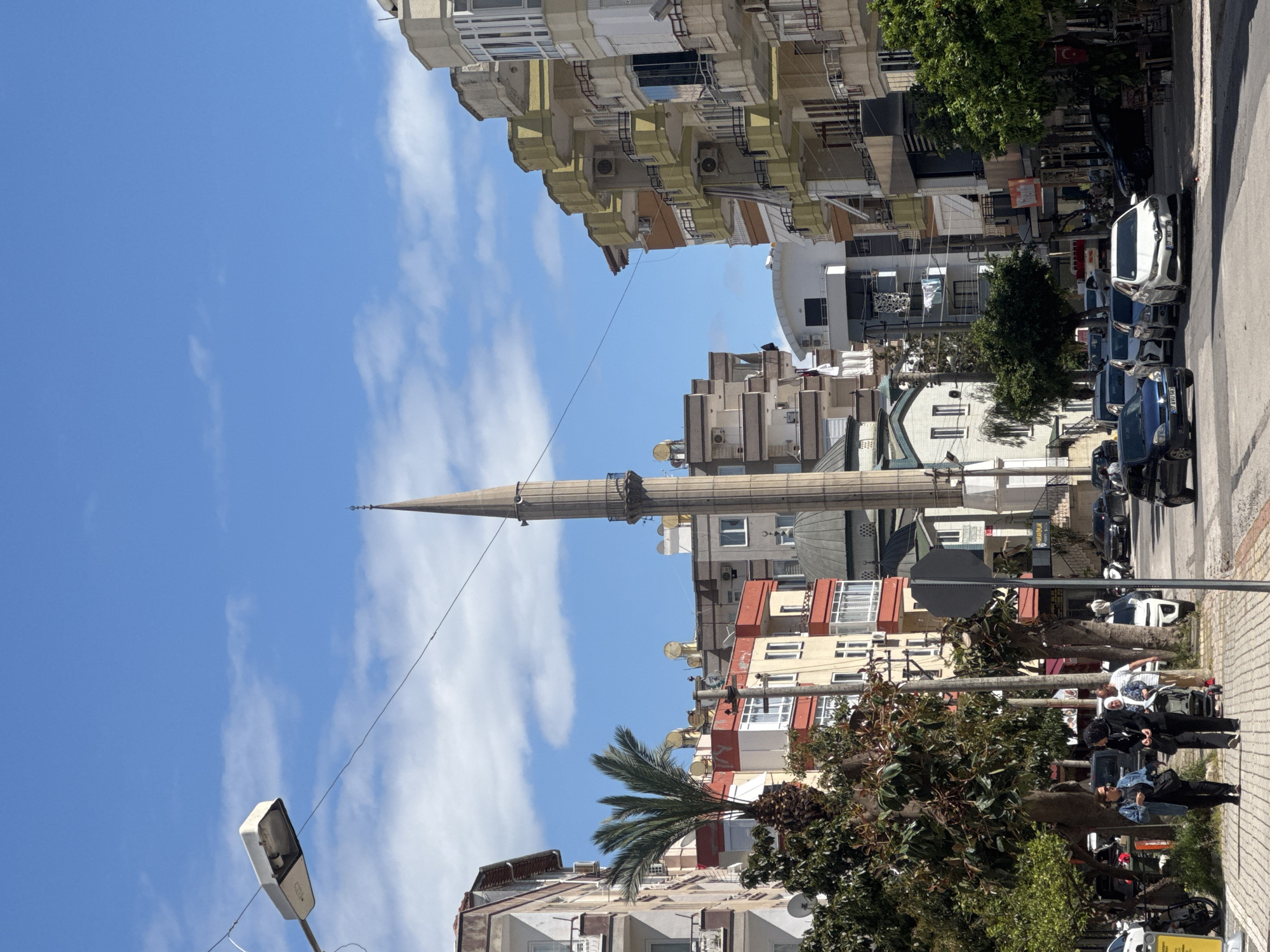 Urban street scenes documented in mountainous city with mosque