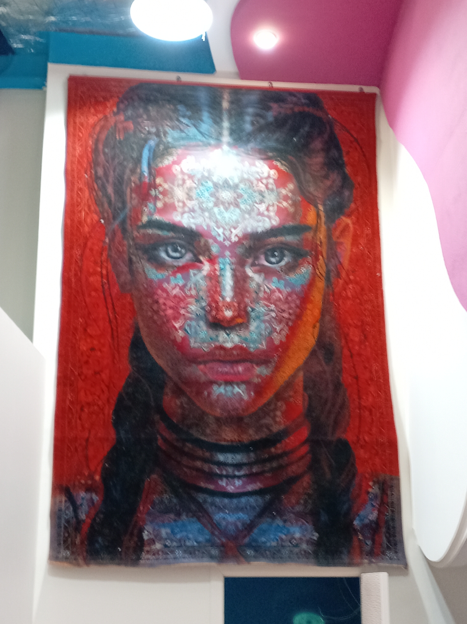 Mixed urban observations: portrait, luxury car, provocative cat artwork