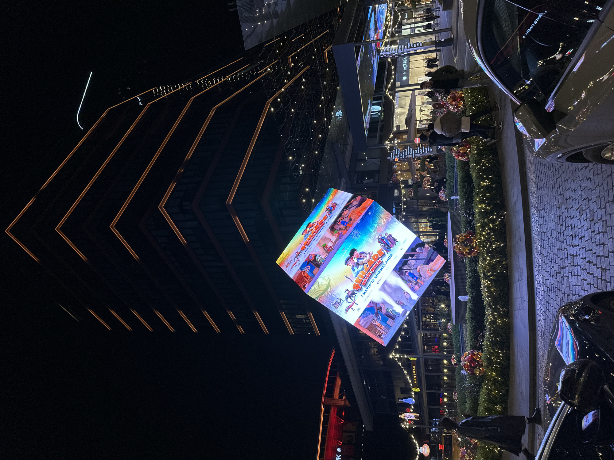 Animated film advertisement display illuminates Sarıyer district at night