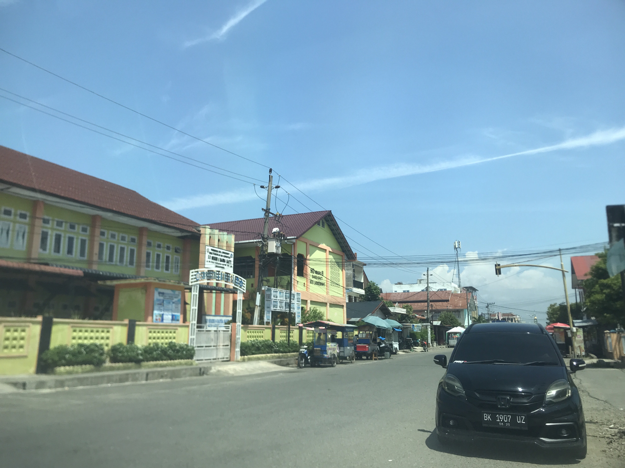 Morning street life and coffee culture in Lhokseumawe, Indonesia