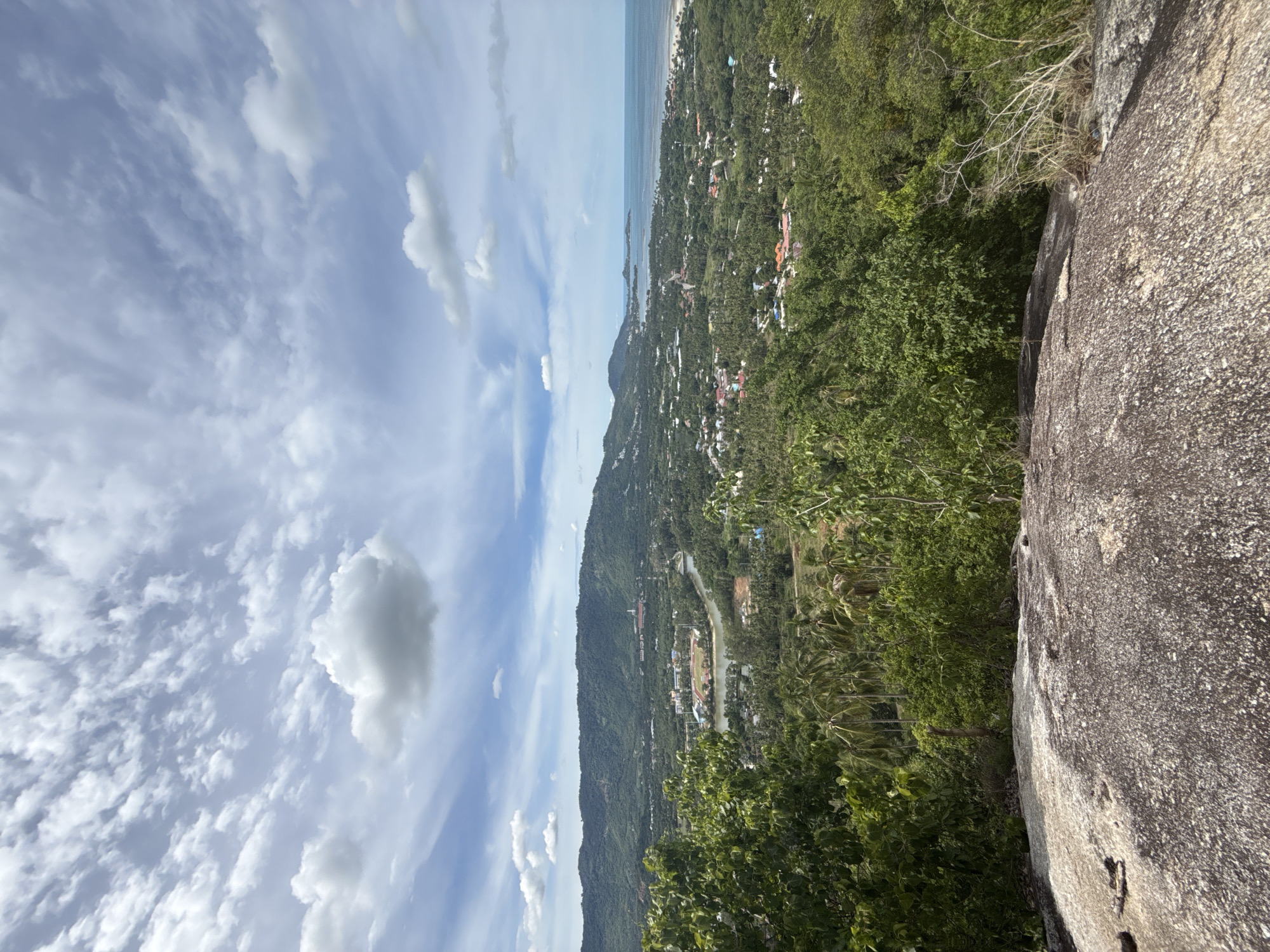 Hilltop views and rocky details above Baan Harn's coastline