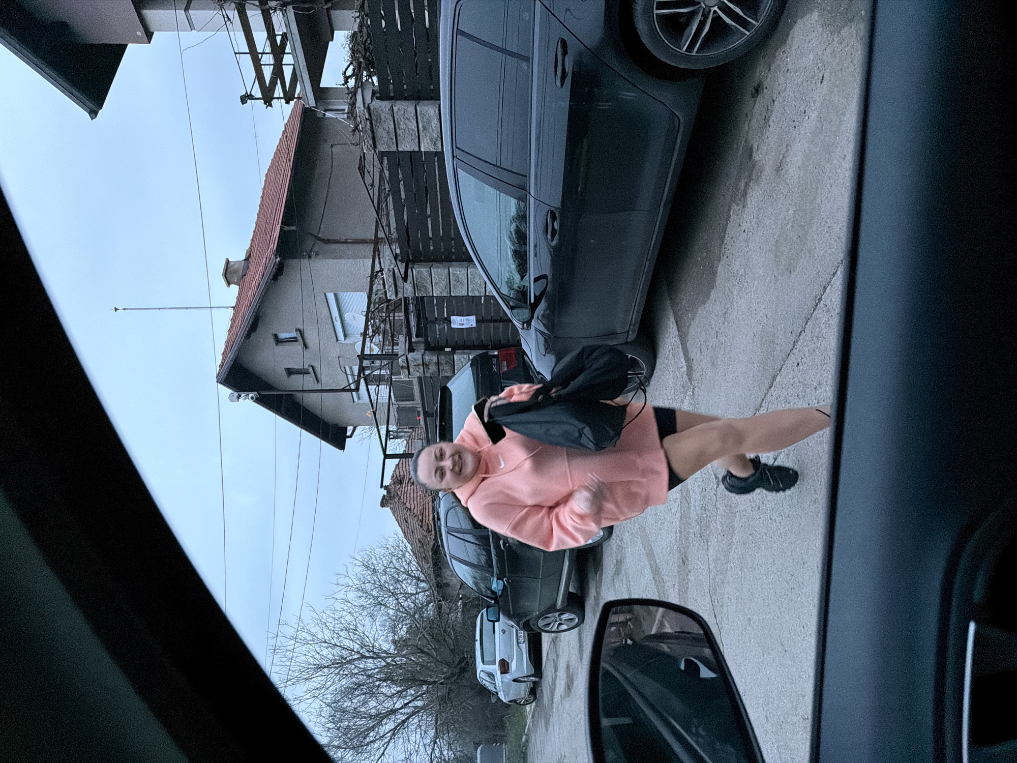Woman poses for photo on residential street in Dragichevo